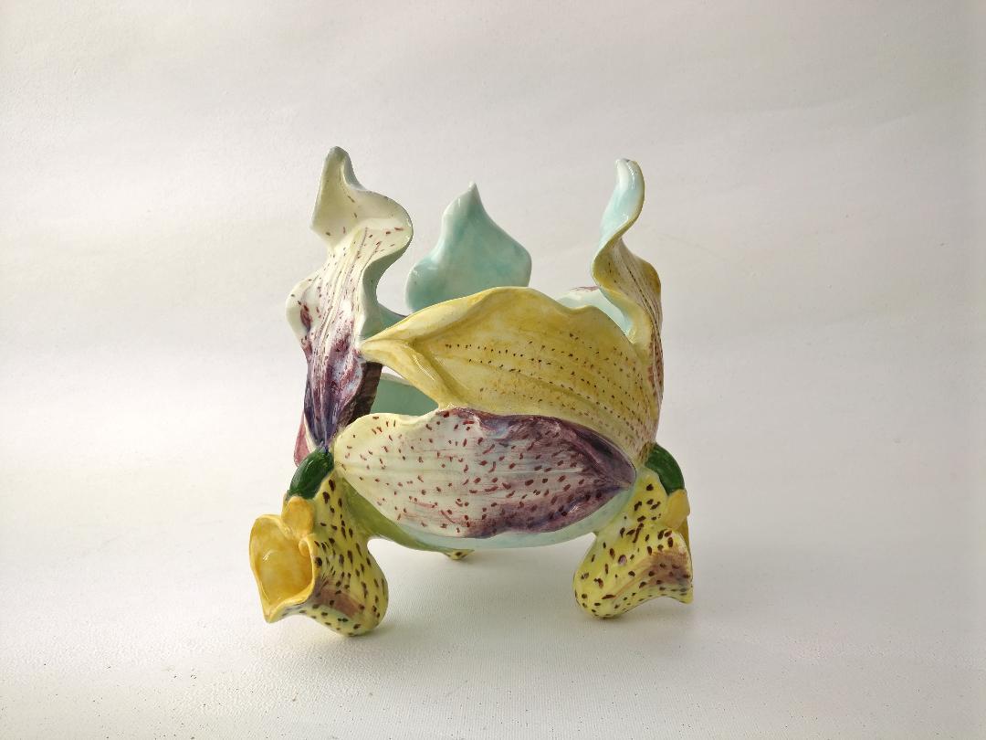 Very rare unique 19th century Majolica orchid cache pot signed Delphin Massier, the three sides have different colors.
The Massier family are known for the quality of their unique enamels and paintings. They produced an incredible whole range of