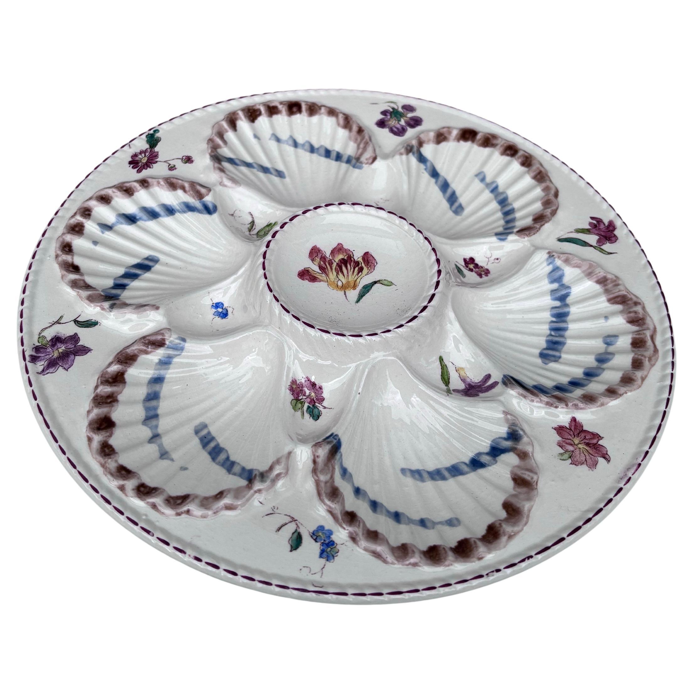 French Majolica oyster plate with flowers circa 1890 signed Longchamp.