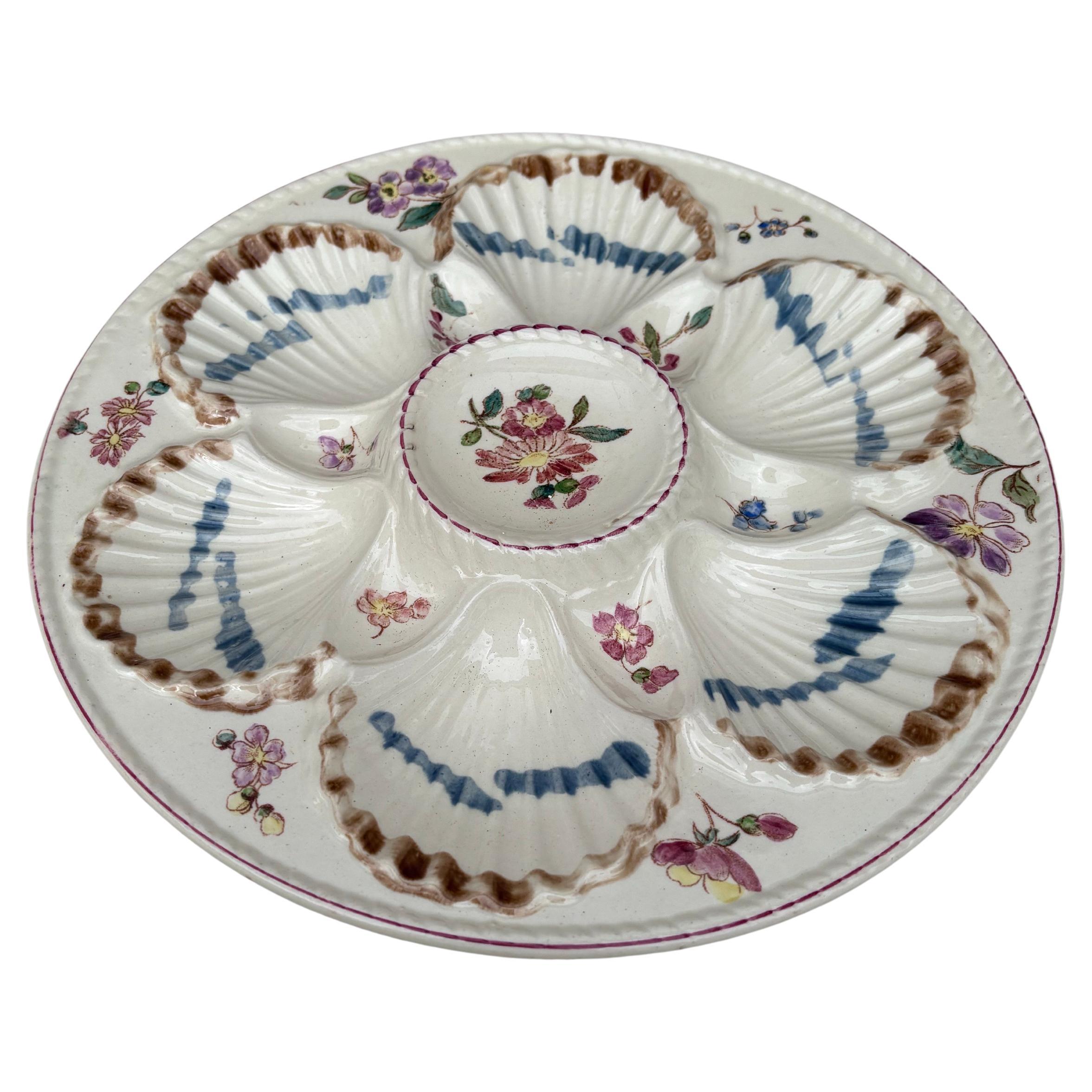 French Majolica oyster plate with flowers circa 1890 signed Longchamp.