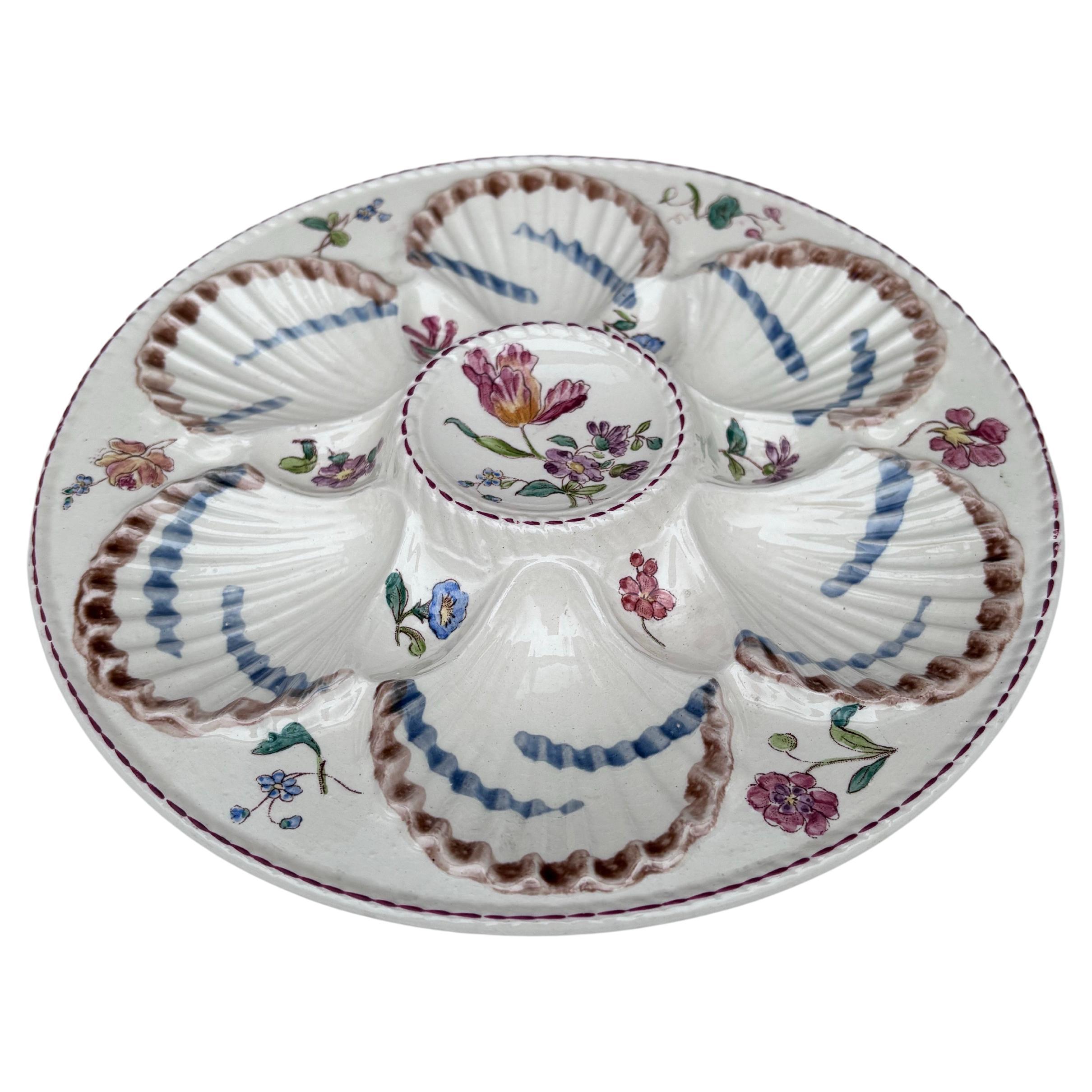 French Majolica oyster plate with flowers circa 1890 signed Longchamp.