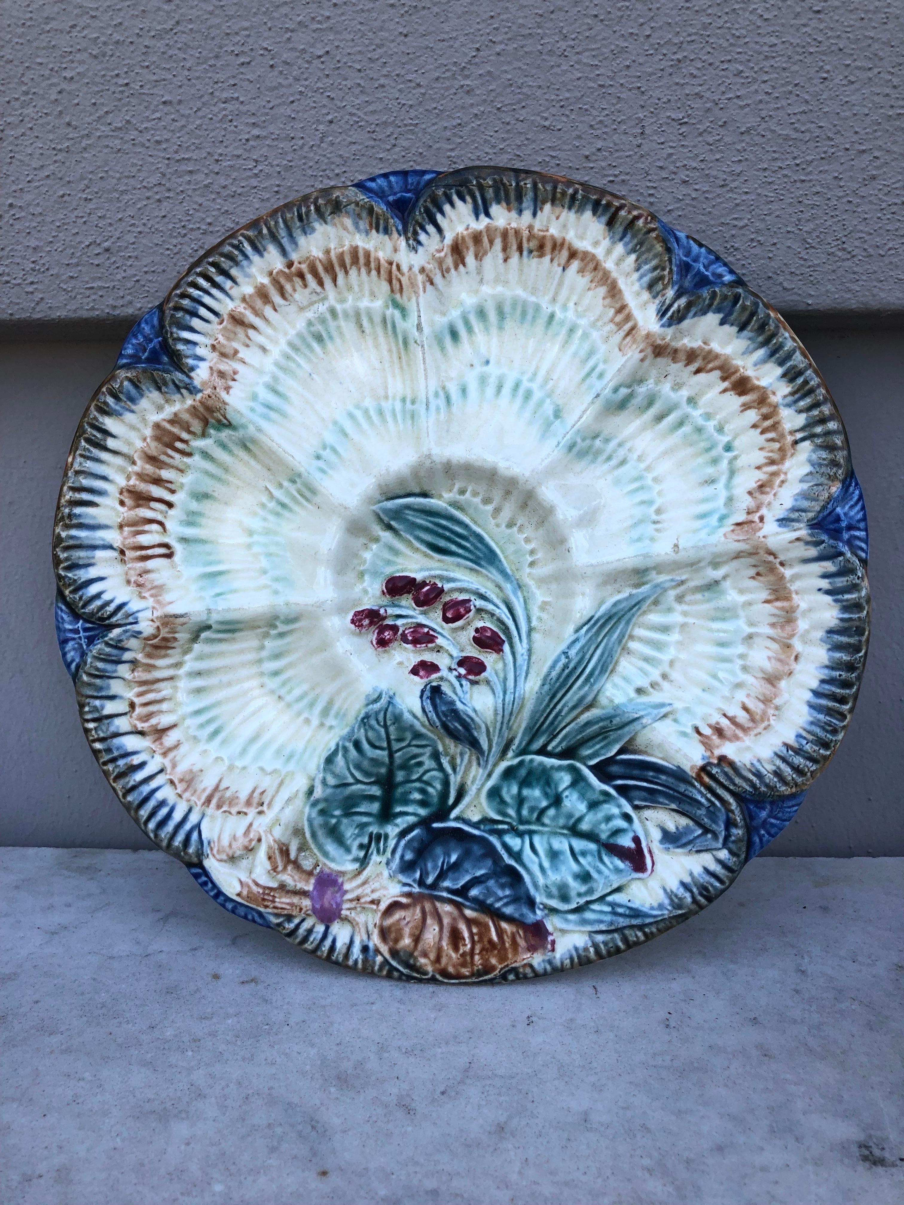 19th-century Majolica oyster plate Wasmuel (Belgium) decorated with flowers.