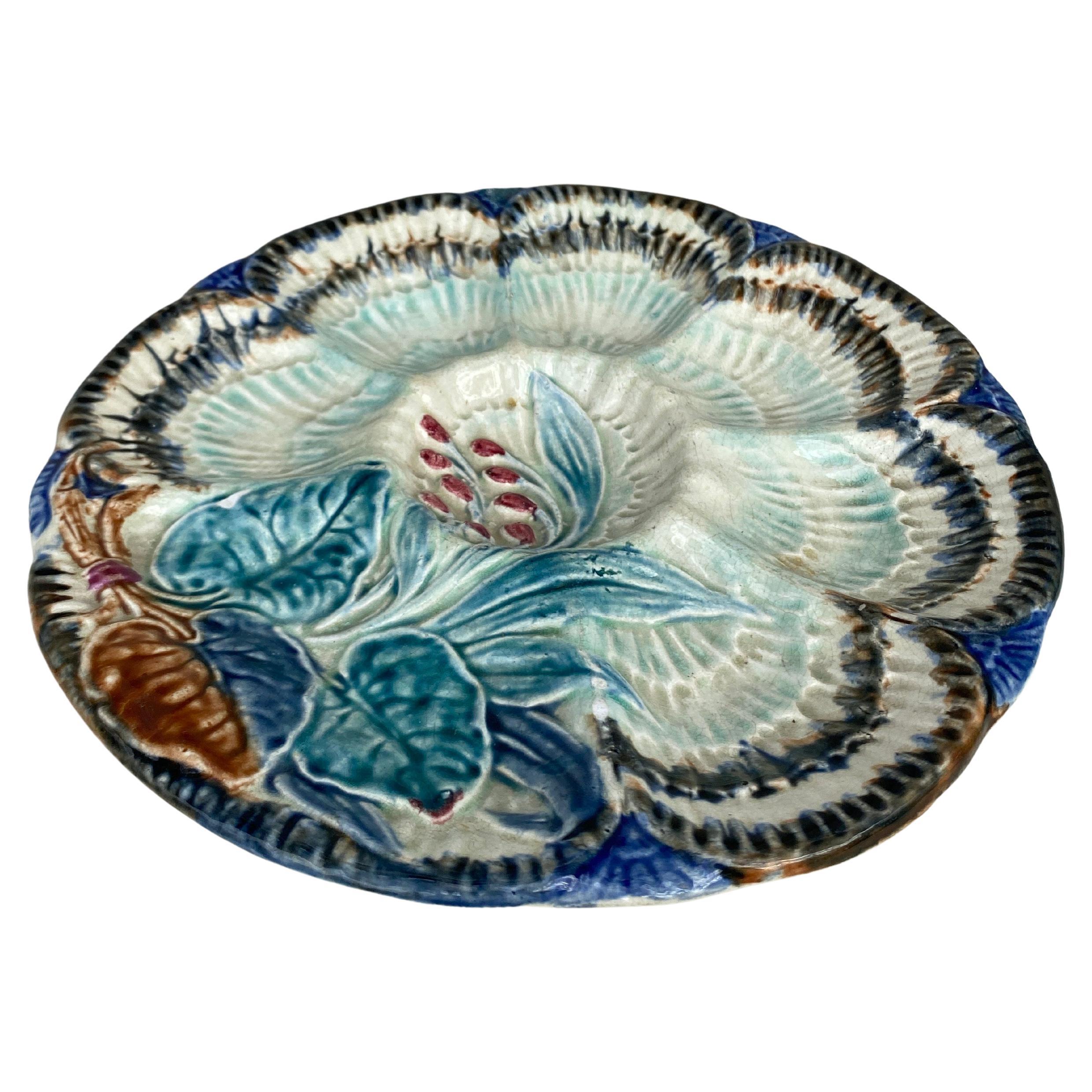 19th Century Majolica oyster plate Wasmuel (Belgium) decorated with flowers.