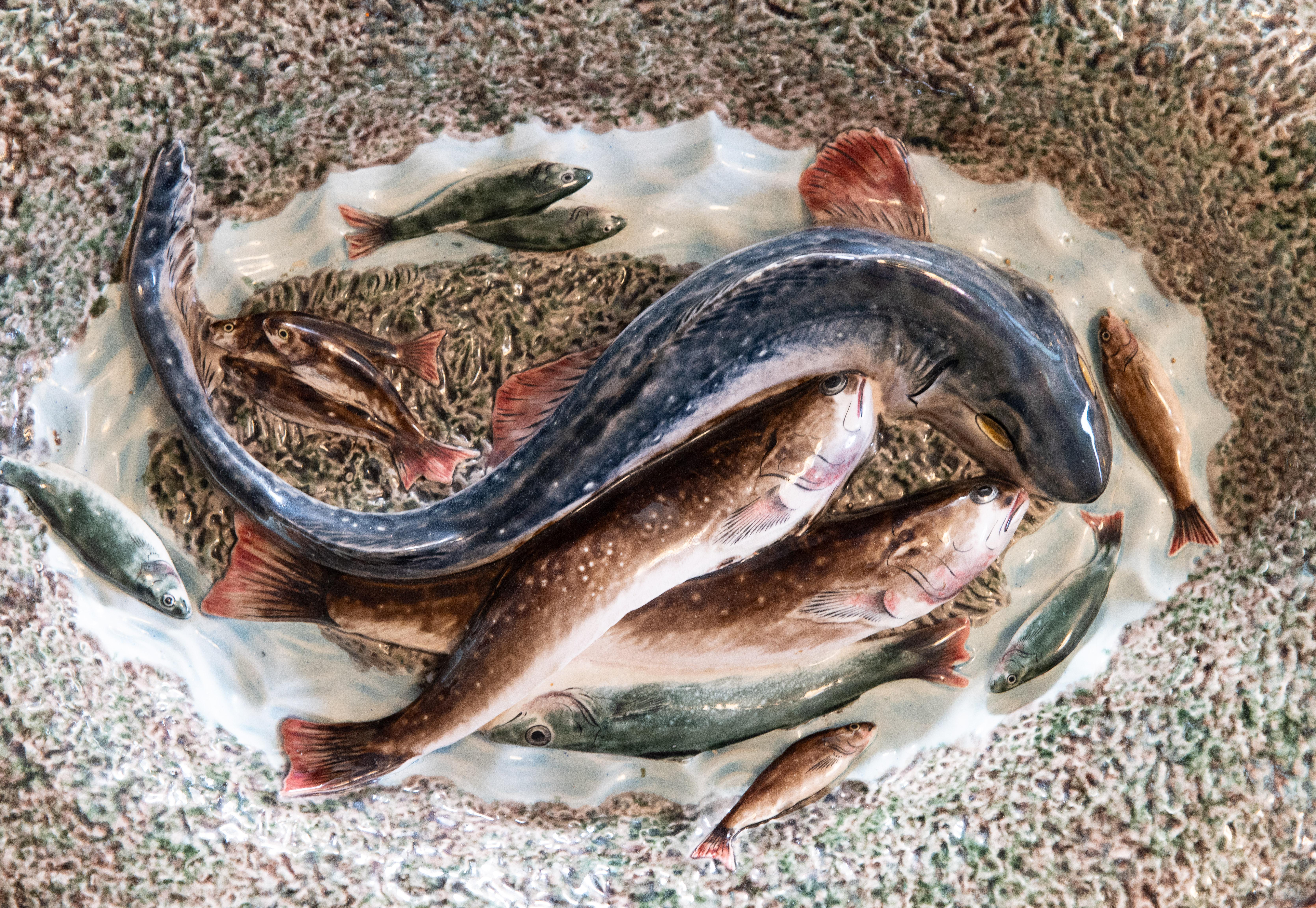 Very large oval late 19th Century French Palissy platter decorated with fish in blues, browns and green in high relief. It's an impressive size and heavy, weighing over 12 lbs. A fantastic find!