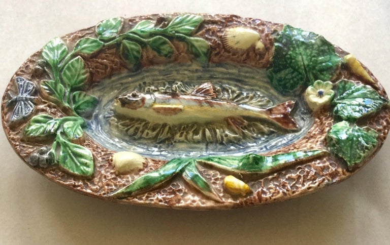 Small Palissy platter with fish, shells, butterfly and plants, circa 1880 signed Thomas Sergent.