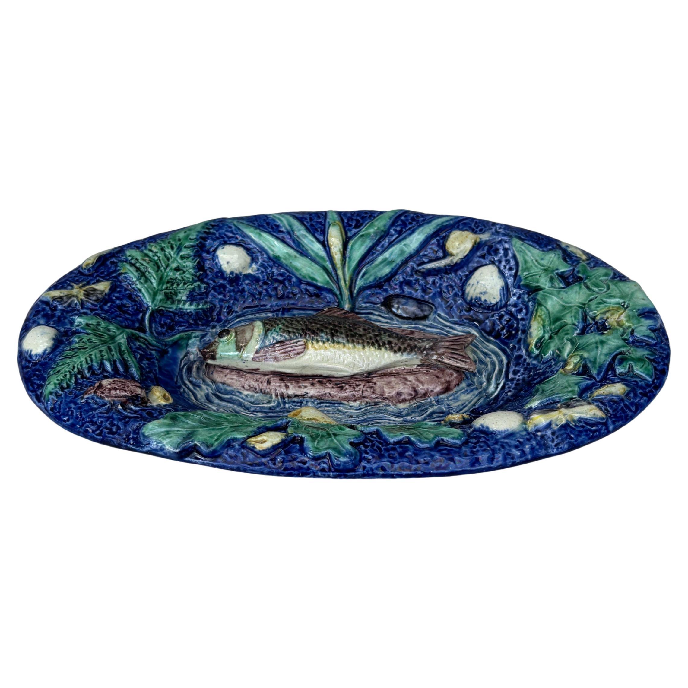 19th Century small oval Palissy Thomas Sergent.
7.5 inches W. by 4.5 inches H.
Fish on the center , shells , ivy , oak leaves , bugs , snail.
Thomas Victor Sergent was an active member of the School of Paris with others ceramists he made platters
