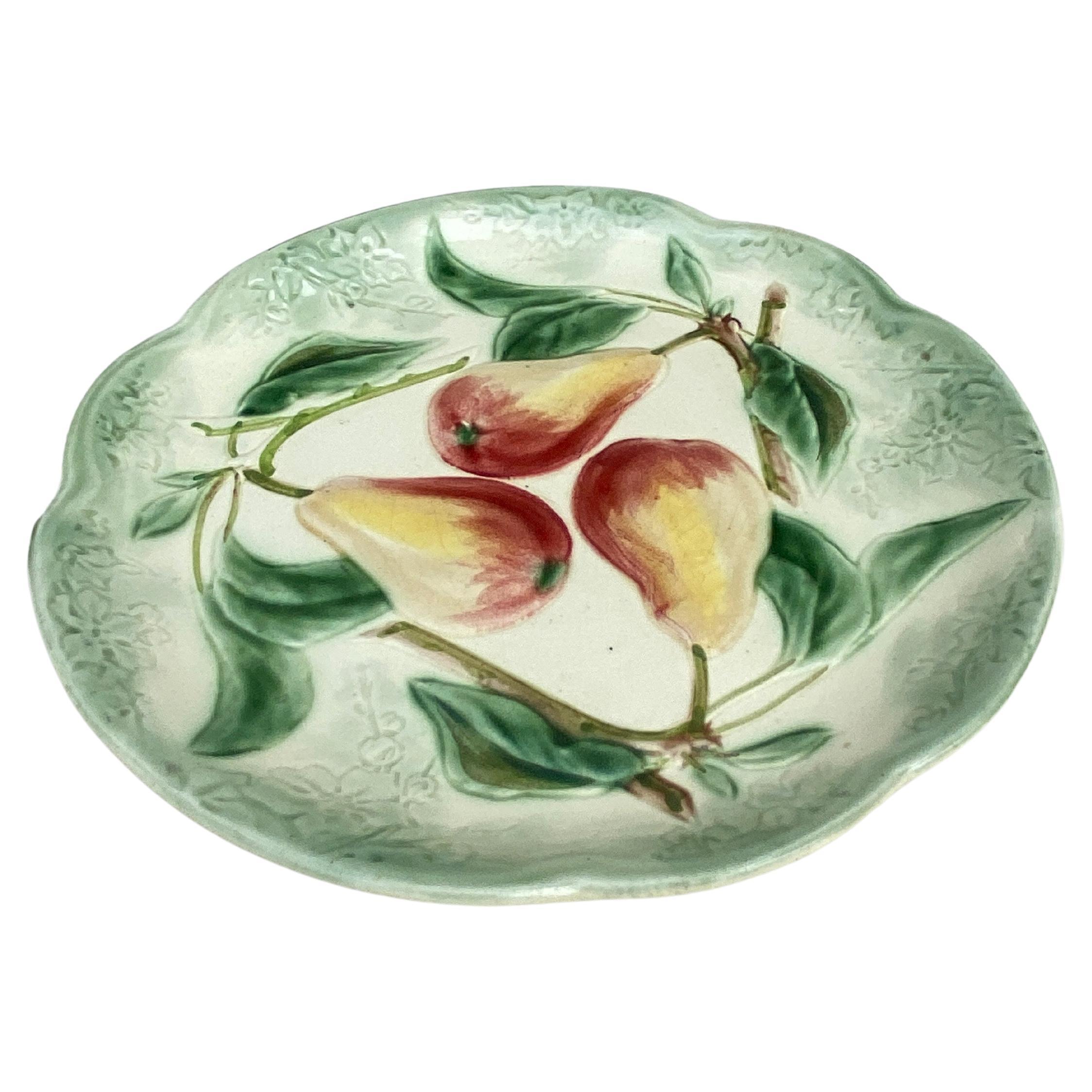 19th Century Majolica pears plate signed Choisy Le Roi.
Made for Higgins & Seiter New York.
The higgins & Seiter Company of New York City began selling decorations for the table, including rich-cut glass in 1887. By 1891 the firm was
