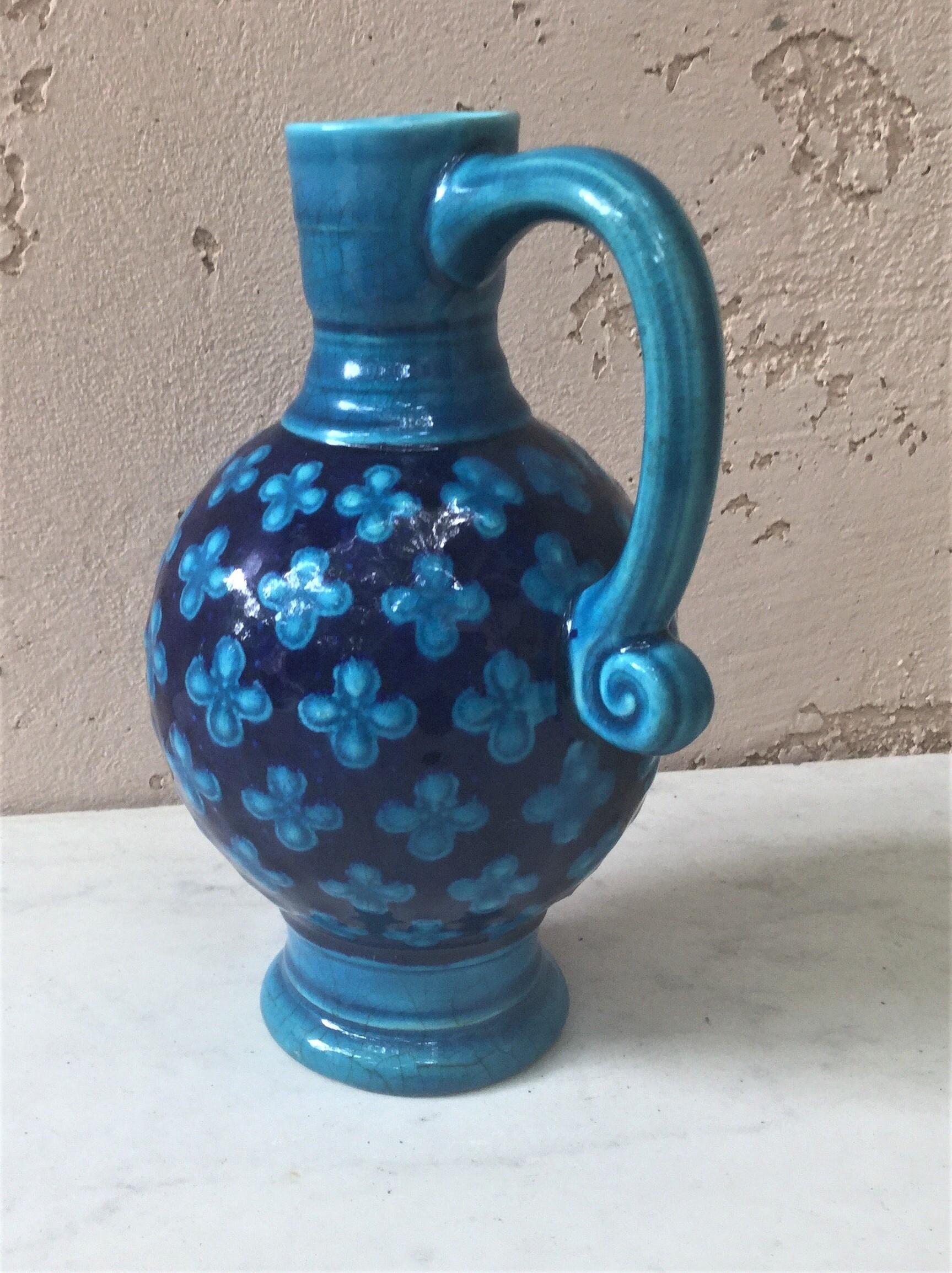 English Victorian Majolica pitcher with a geometrical pattern of shells in a quatrefoil shape signed Minton.
Shape number 596.