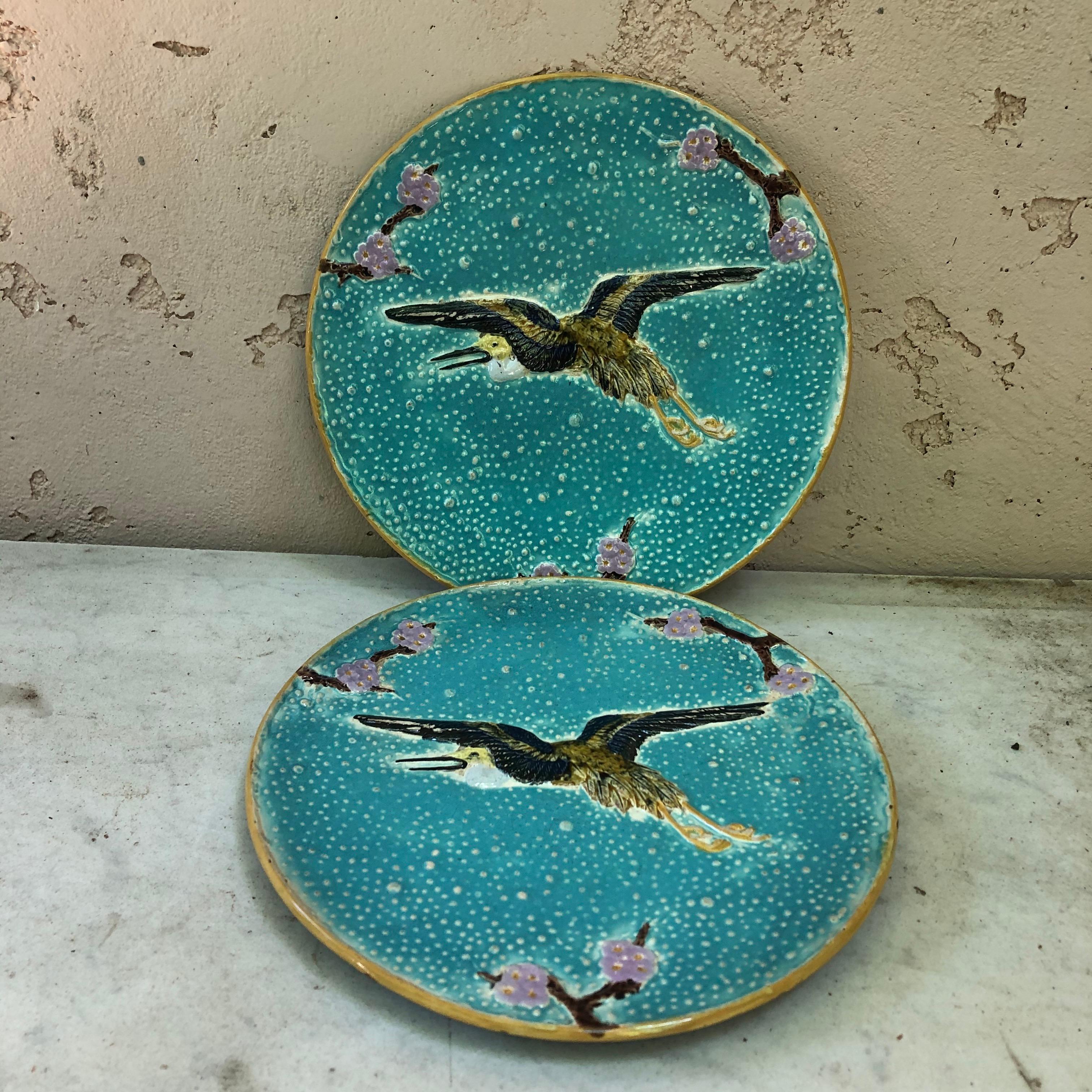 19th century Majolica plate with crane flying signed Joseph Holcroft.