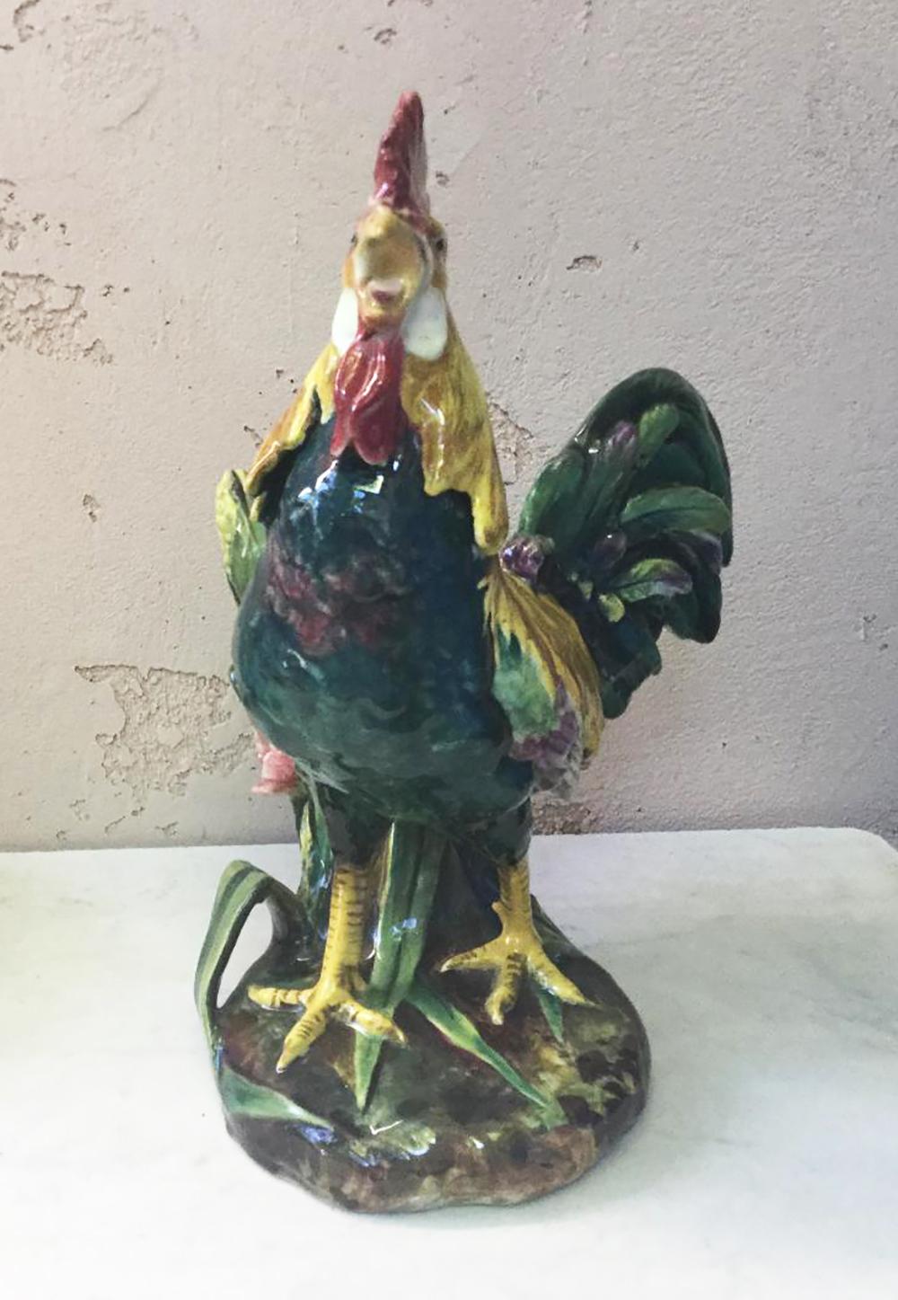 Antique Majolica rooster with leaves, corn and wild rose vase signed Delphin Massier, circa 1890.
The Massier produced roosters in a big range of sizes, this is the medium size. The roosters are the symbol of France and they were very popular on