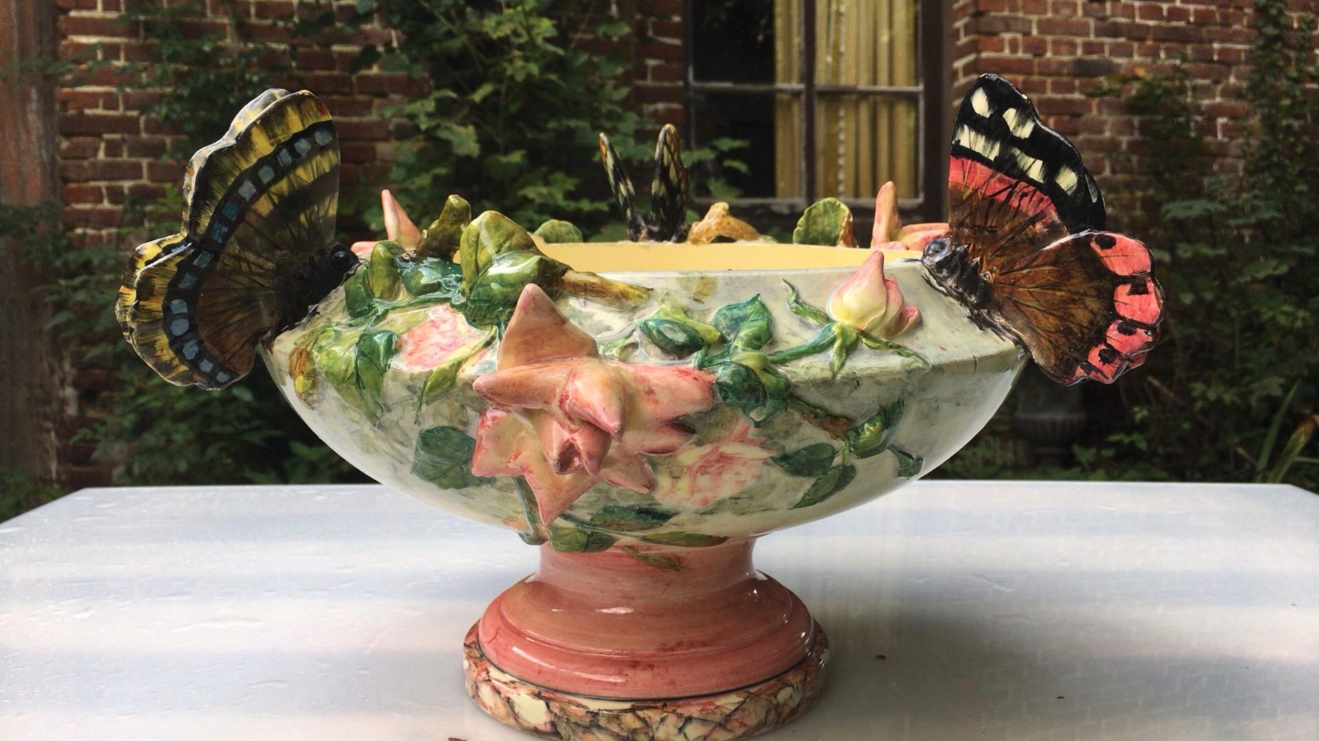 This is one of the most lovely Majolica Art Nouveau cachepot jardinière signed by Delphin Massier, inspired by the nature with roses and three different butterflies.
The Massier family produced different pieces with animals in a very creative style