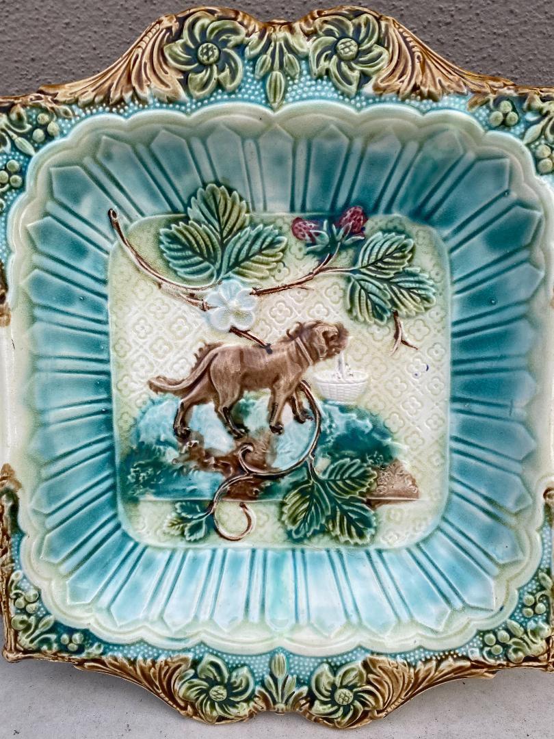 Unusual French Majolica strawberry server with cream and sugar spaces, circa 1890, attributed to Onnaing.
Sophistiqued leaves border, the center is decorated with strawberries and a dog holding a basket.
