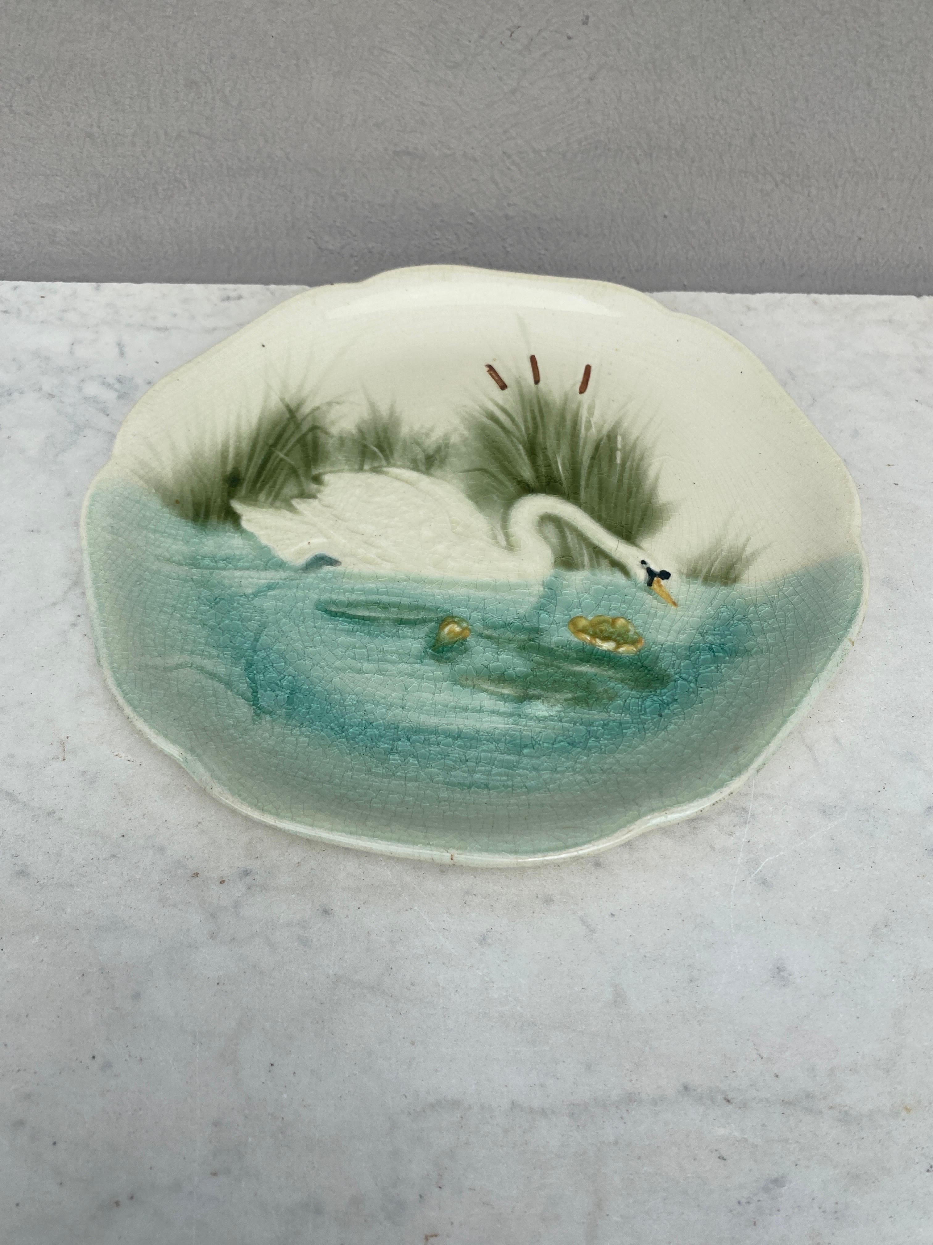 Majolica plate with a swan on a pond signed Hippolyte Boulenger Choisy le Roi, circa 1890.
The manufacture of Choisy le Roi was one of the most important manufacture at the end of 19th century, they produced very high quality ceramics of all kinds