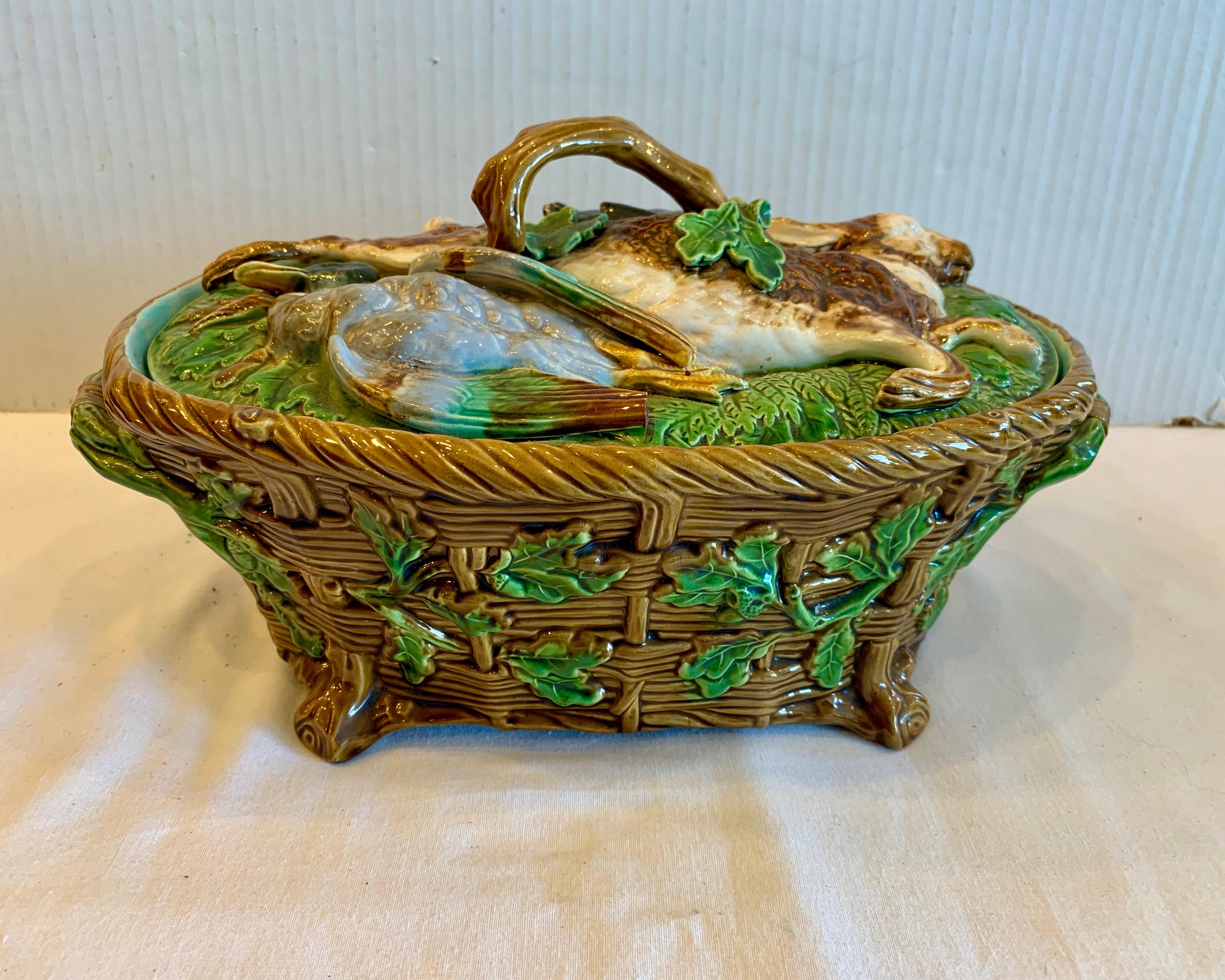 fashioned with a figure of a rabbit and a bird on its lid.
The piece is superbly detailed with basket form design and fitted with with 
handles at its sides.