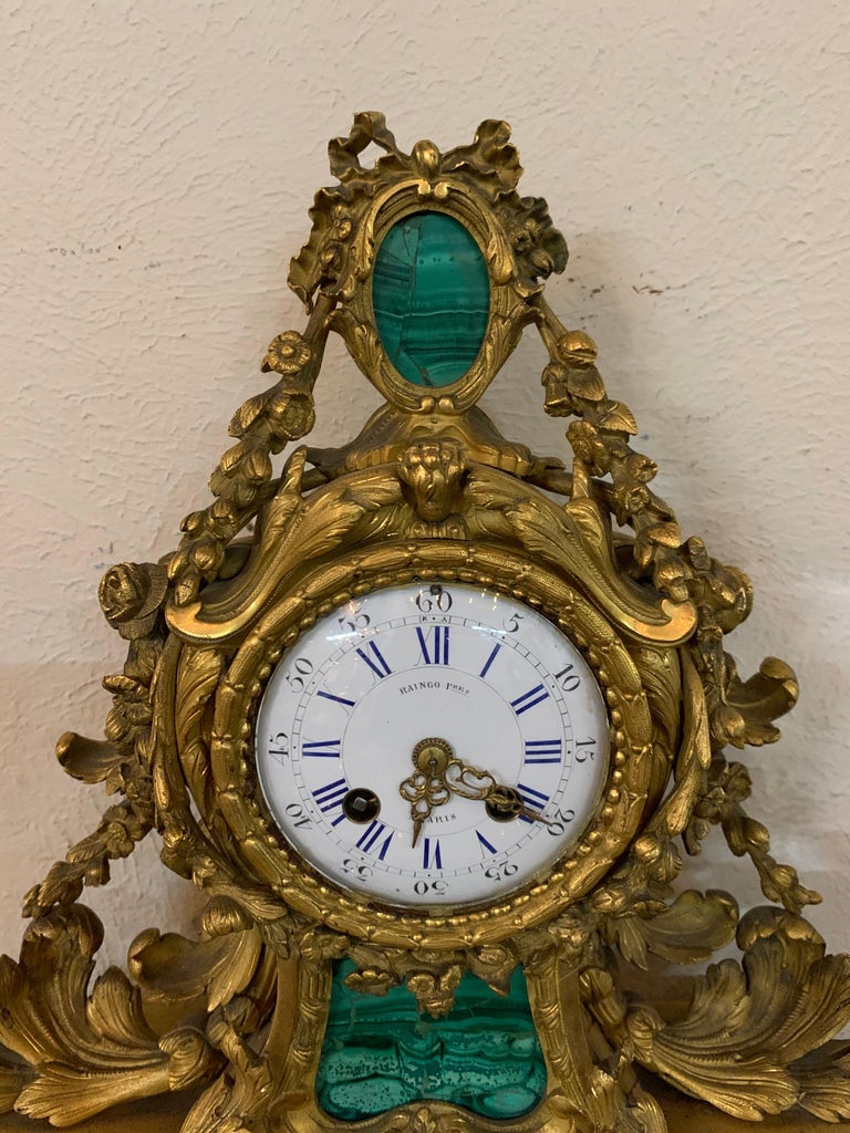 Beautiful decorative 19th century malachite and gilt bronze clock. Gorgeous scrolling bronze next to the brilliant green, makes for s striking image! A fabulous accessory!
