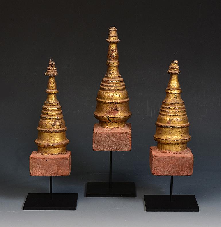 A set of antique Burmese wood carving Pagoda.

Age: Burma, Mandalay Period, 19th Century
Size of pagoda only: Height 16.4 - 18.8 C.M. / Width 6 - 6.4 C.M.
Height including stand: 21.8 - 25.7 C.M.
Condition: Nice condition overall (some expected