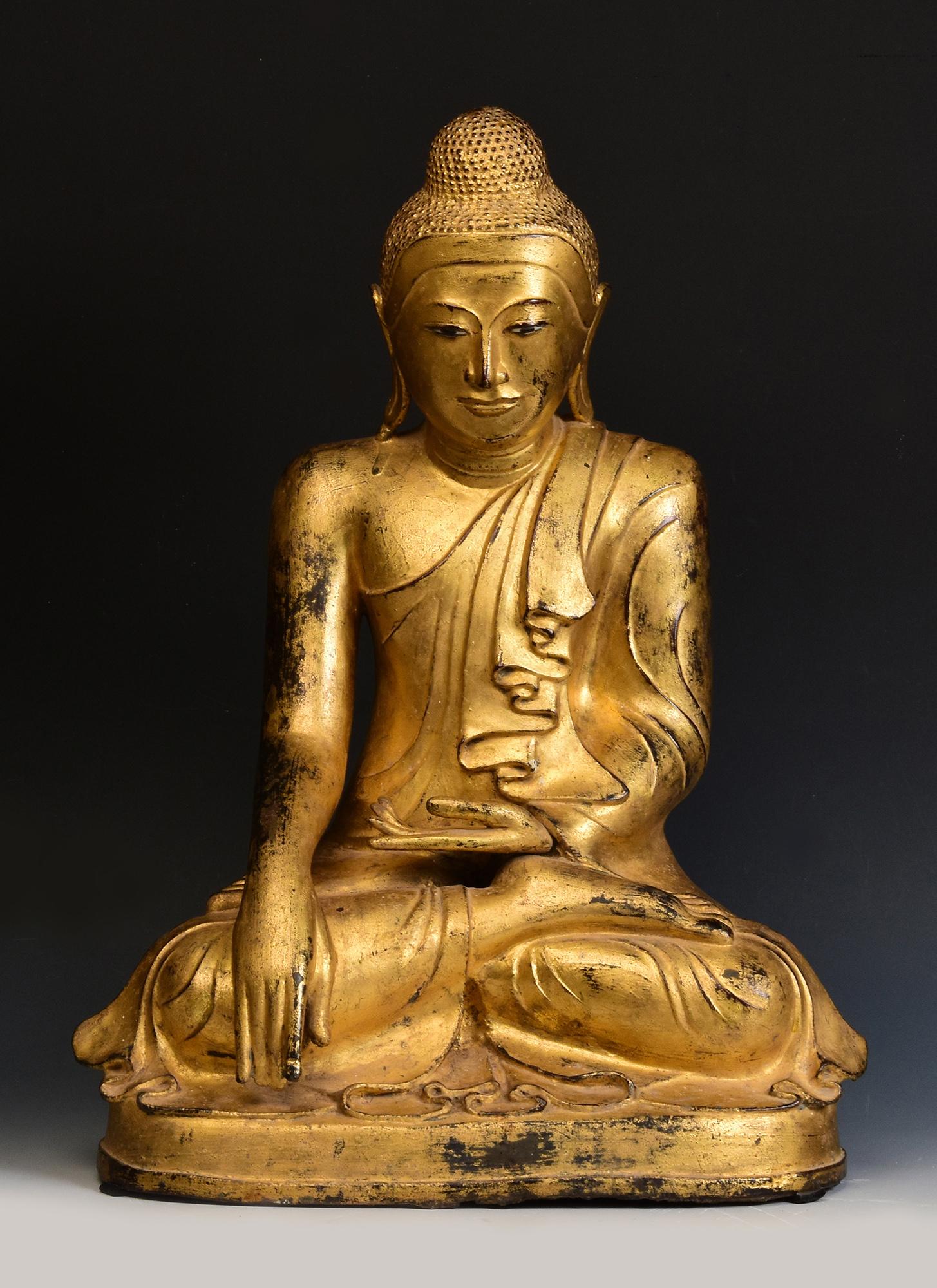Burmese bronze Buddha sitting in Mara Vijaya (calling the earth to witness) posture on a base, with gilded gold.

Age: Burma, Mandalay Period, 19th Century
Size: Height 55 C.M. / Width 41 C.M. / Depth 28 C.M.
Condition: Nice condition overall (some