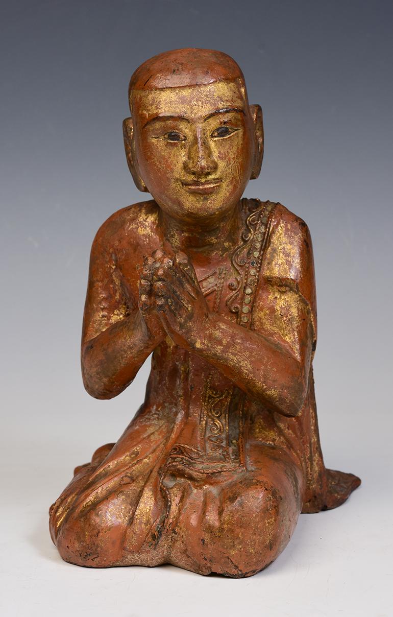Antique Burmese wooden seated disciple.

Age: Burma, Mandalay Period, 19th Century
Size: Height 25 C.M. / Width 16.7 C.M. / Length 20 C.M.
Condition: Nice condition overall (some expected degradation due to its age). 

100% satisfaction and