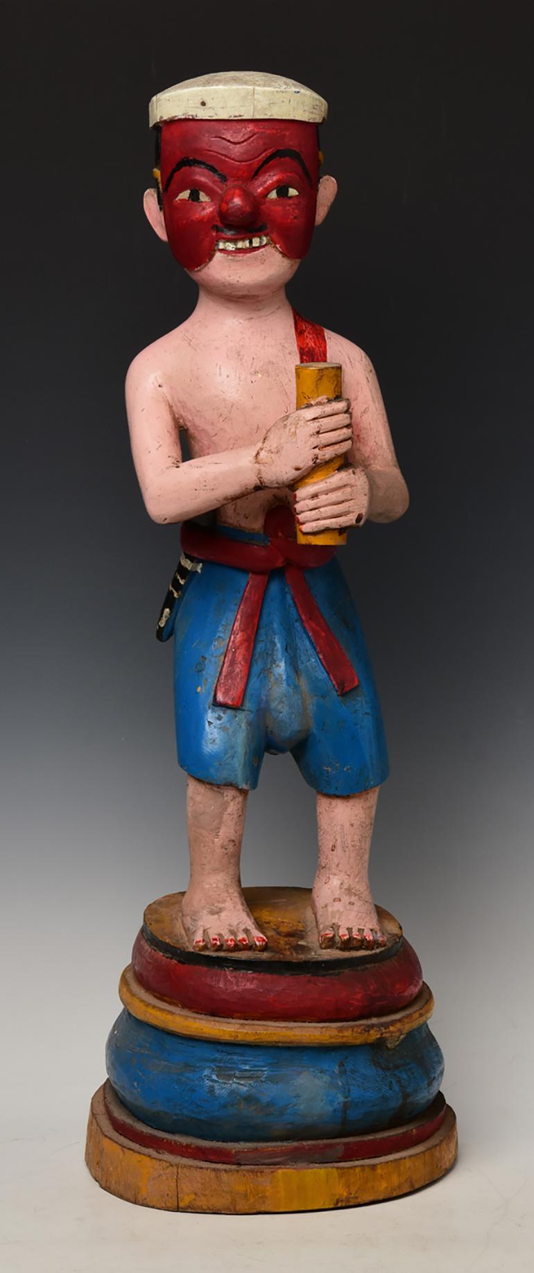 Antique Burmese wooden standing figure.

Age: Burma, Mandalay Period, 19th Century
Size: Height 64 C.M. / Width 21 C.M.
Condition: Nice condition overall (some expected degradation due to its age).

100% satisfaction and authenticity guaranteed with
