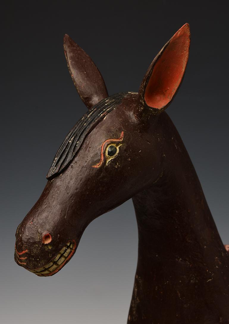 Burmese wooden walking horse figurine.

Age: Burma, Mandalay Period, 19th Century
Size: Height 47 C.M. / Length 50.3 C.M.
Condition: Nice condition overall (some expected degradation due to its age).

100% satisfaction and authenticity guaranteed