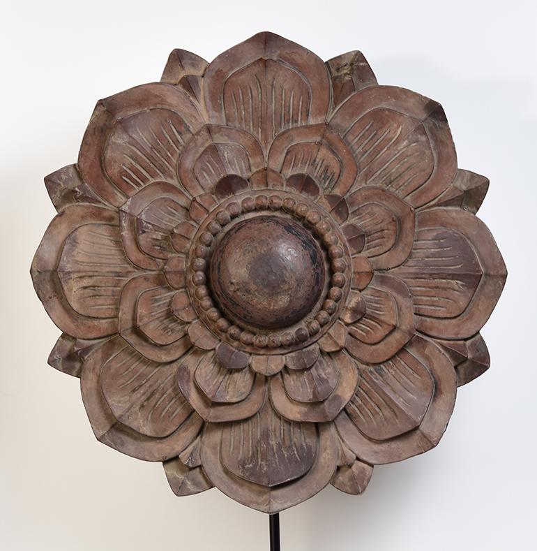 Large antique Burmese wooden flower decoration with stand.

Age: Burma, Mandalay Period, 19th Century
Size: Diameter 71 C.M. / Thickness 10 C.M.
Height including stand: 113 C.M.
Condition: Nice condition overall (some expected degradation due to its