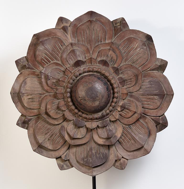 Large Burmese wooden flower decoration with stand.

Age: Burma, Mandalay Period, 19th Century
Size: Diameter 71 C.M. / Thickness 10 C.M.
Size including stand: Height 113 C.M.
Condition: Nice condition overall.

100% satisfaction and authenticity