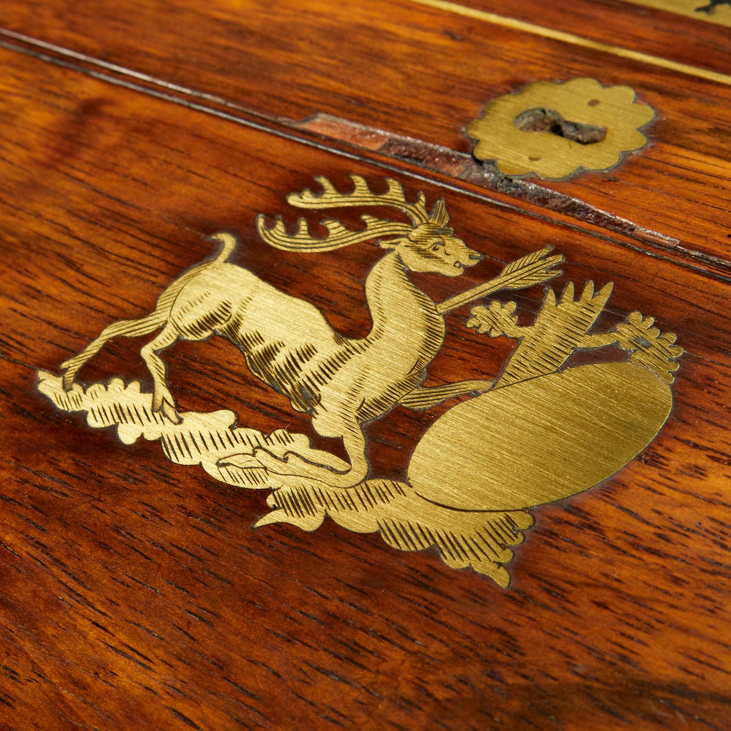 c.1800, England, Regency brass inlaid rosewood lap desk in the manner of George Bullock. Rectangular box with double-hinged lid, opening to tooled navy leather and gold embossed writing surface and compartmentalized storage. Inlaid brass marquetry