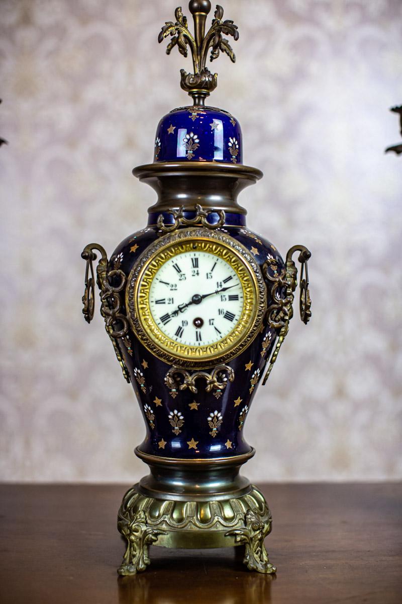 French 19th-Century Sapphire Ceramic Mantel Clock Set with Brass Elements For Sale