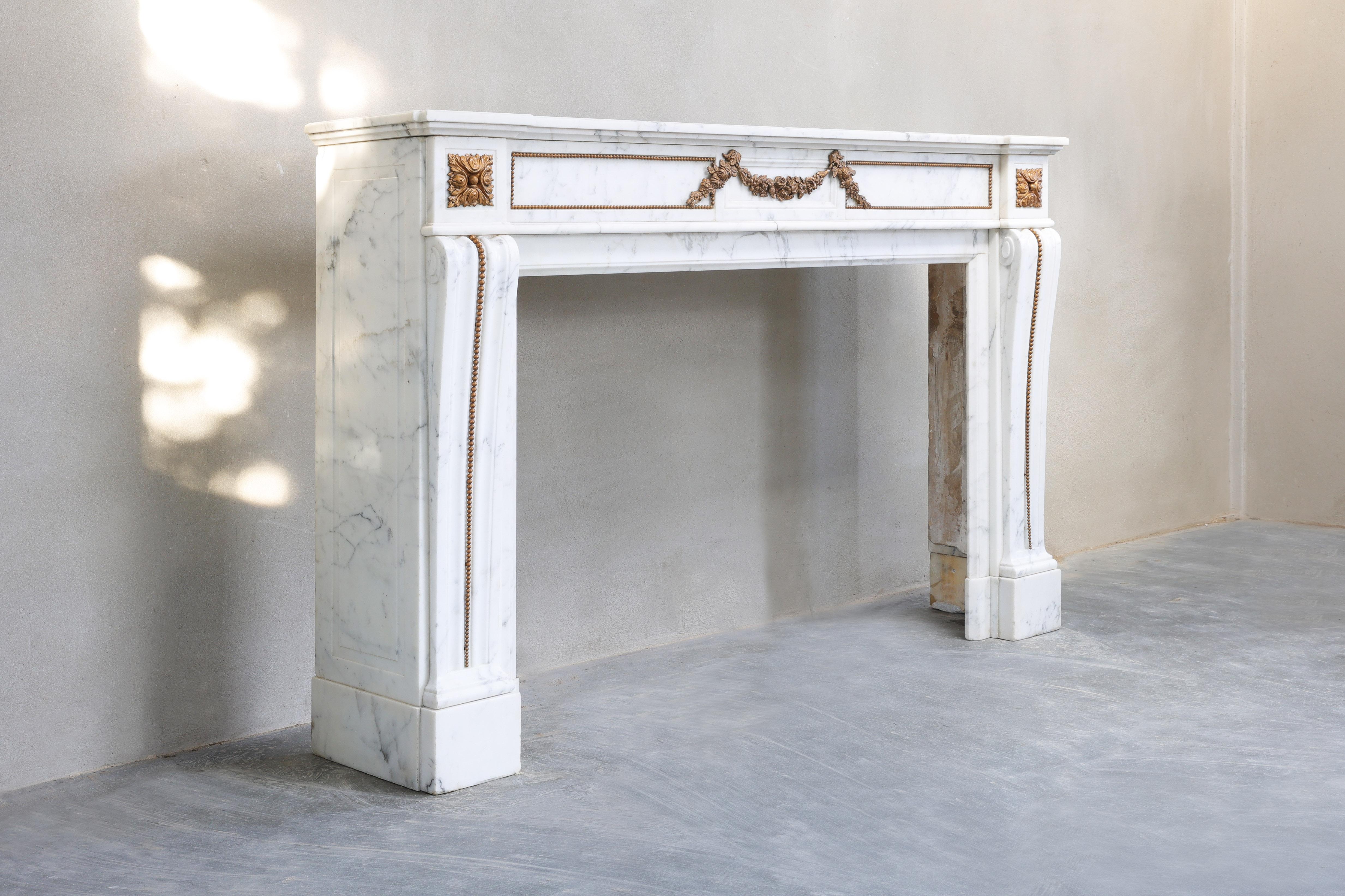 Beautiful antique fireplace made of Arabescato marble! Arabescato is a type of marble extracted from the Apennines mountains north of Carrara, Italy. Arabescato marble has always been veined. This fireplace dates from the year 1880 and is in Louis
