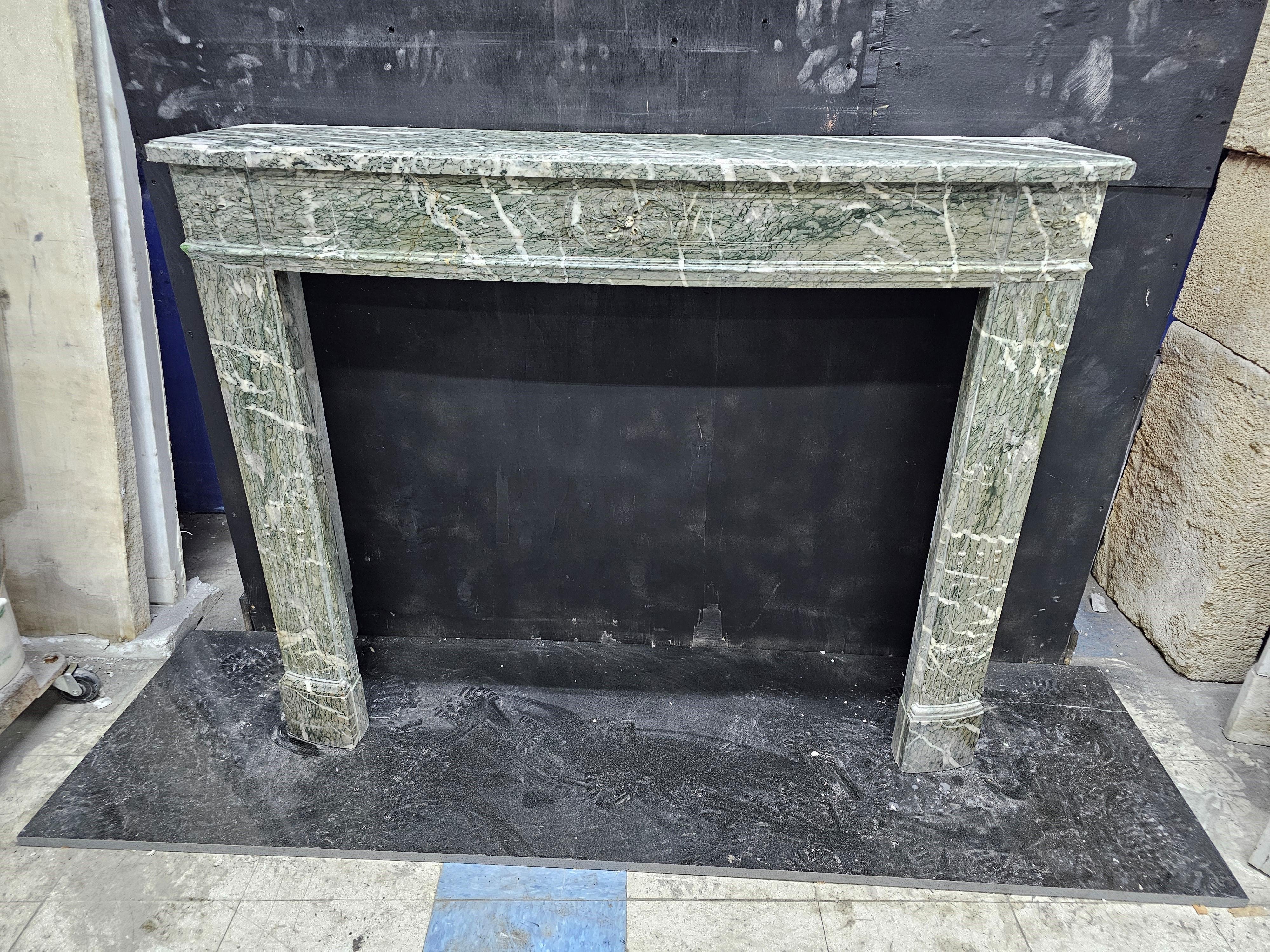 Hand-Carved 19th Century Mantelpiece in Campan Green Marble For Sale