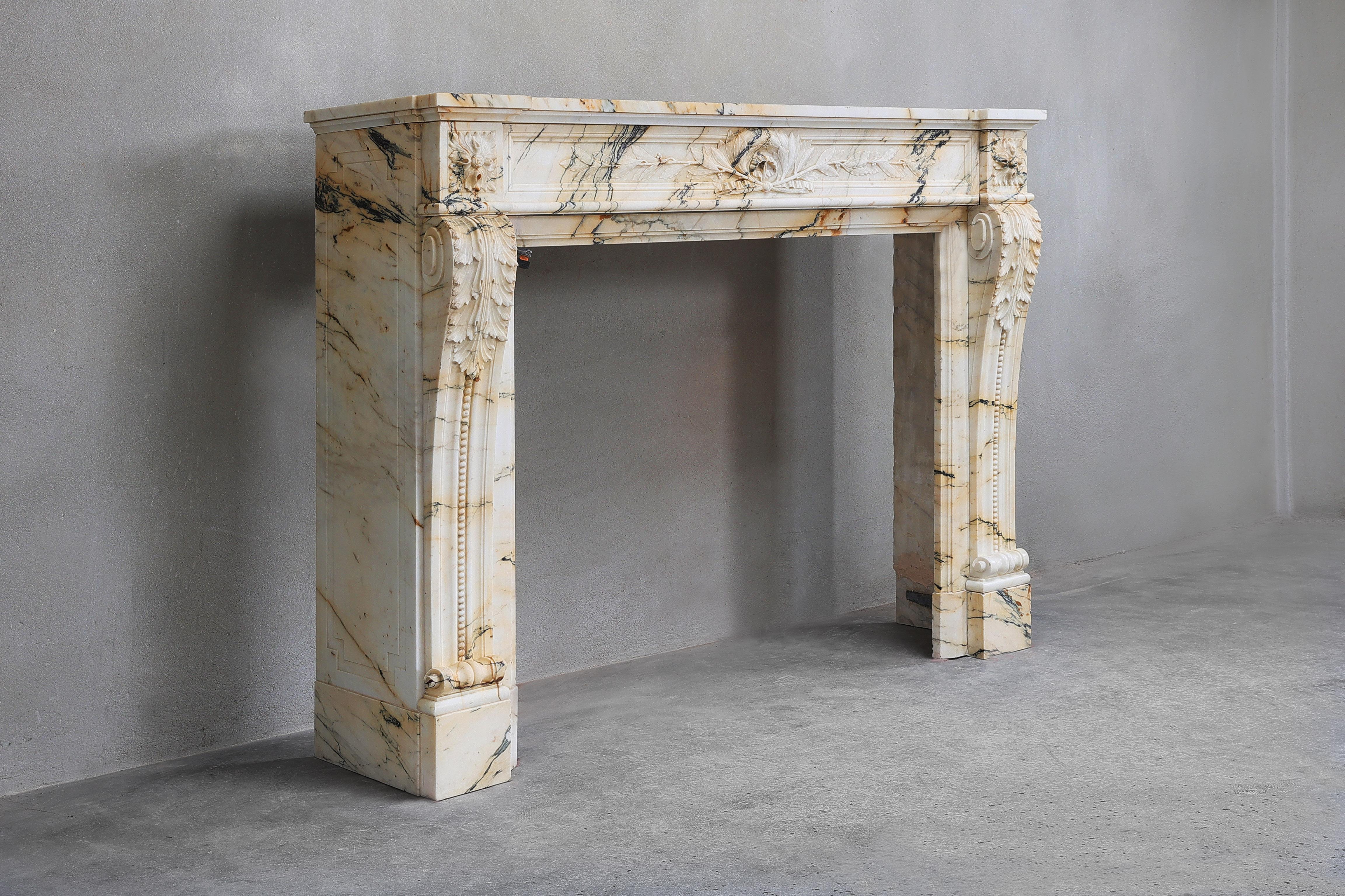 Very nice antique fireplace made of the exclusive Paonazzo marble. This fireplace dates from the 19th century and is in the style of Louis XVI. Fitted with feuille d'aconte on the legs and feuille de laurier. Paonazzo marble is, next to Sienna