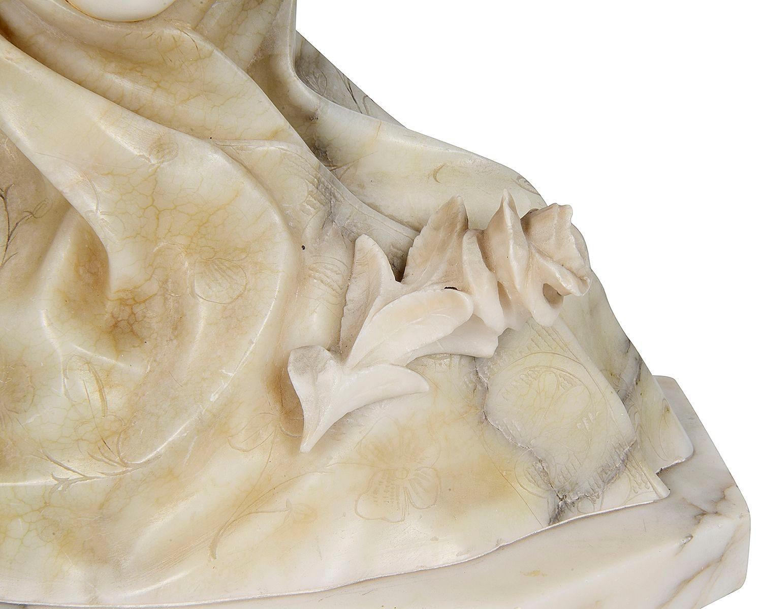 A late 19th Century French hand carved Alabaster and marble bust of a hooded young girl.

Batch 74. TUKZ G10001/23