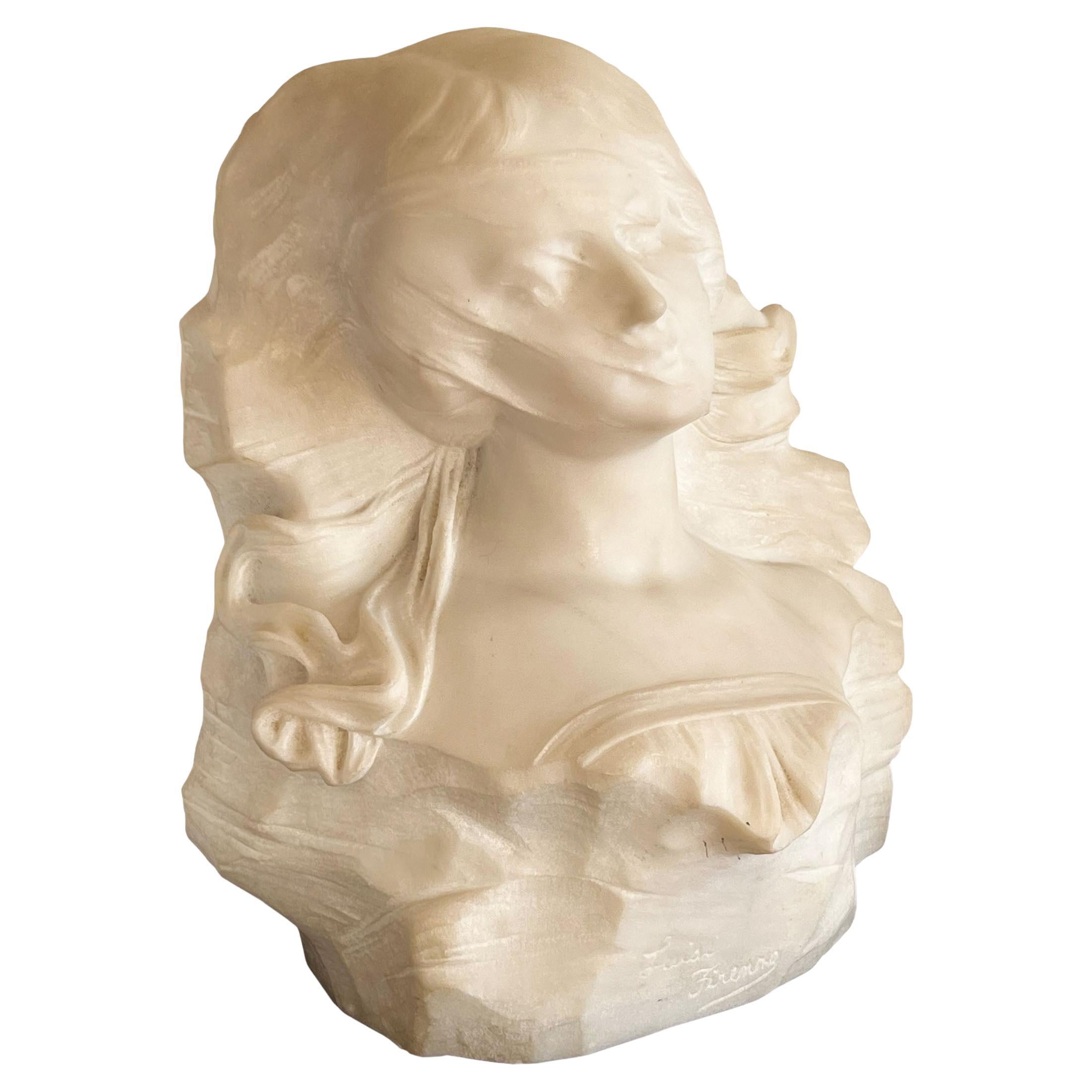 An Italian artist signed 19th century marble bust of a lady. Wearing a ruffled top with a veil partially covering her face. Signed.