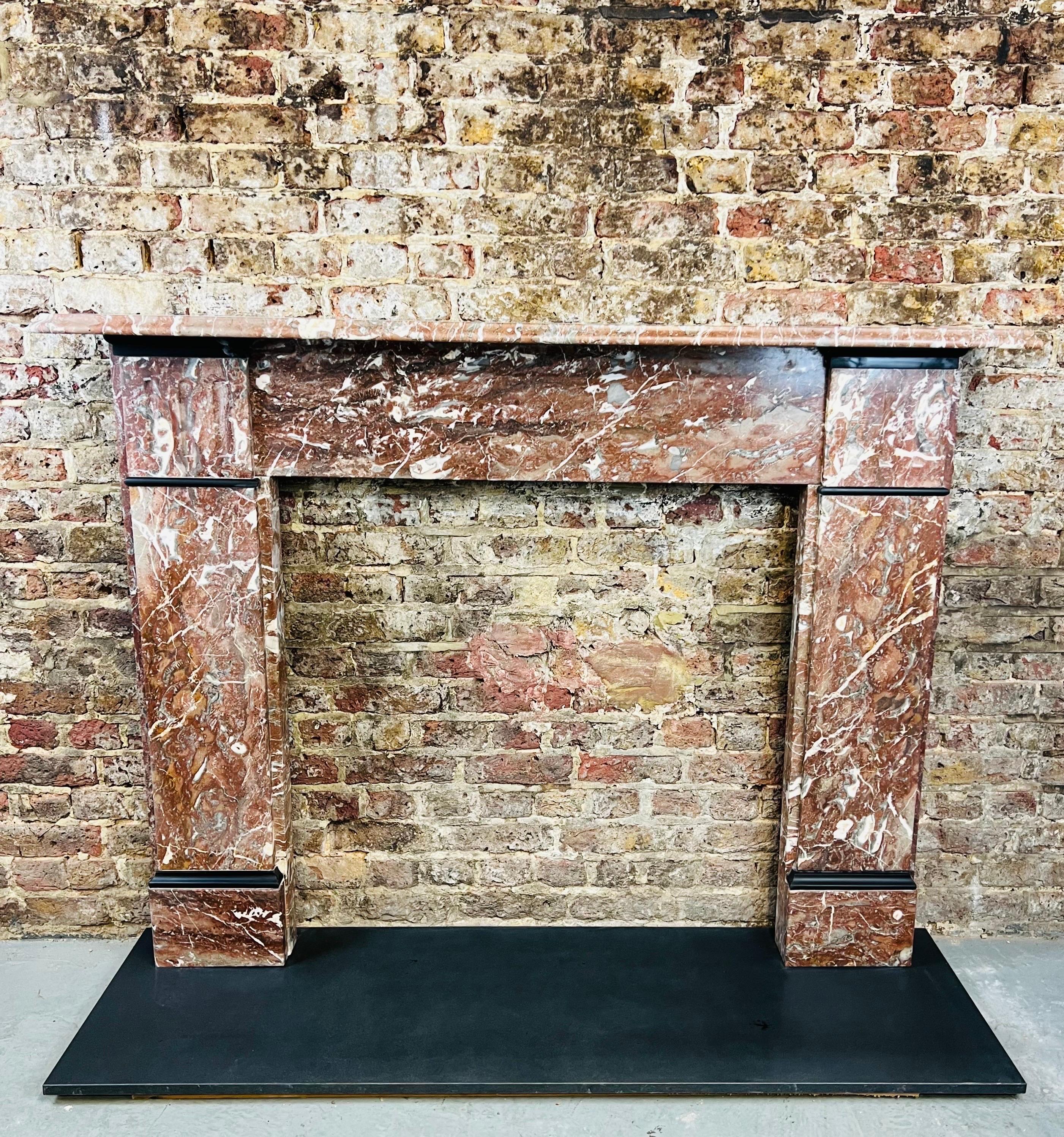 19th Century marble fireplace mantlepiece.
English made original English Victorian rouge marble surround. 
Recently salvaged from a prominent london city town house. 
Dimensions:This fireplace has been lightly restored and polished back to its