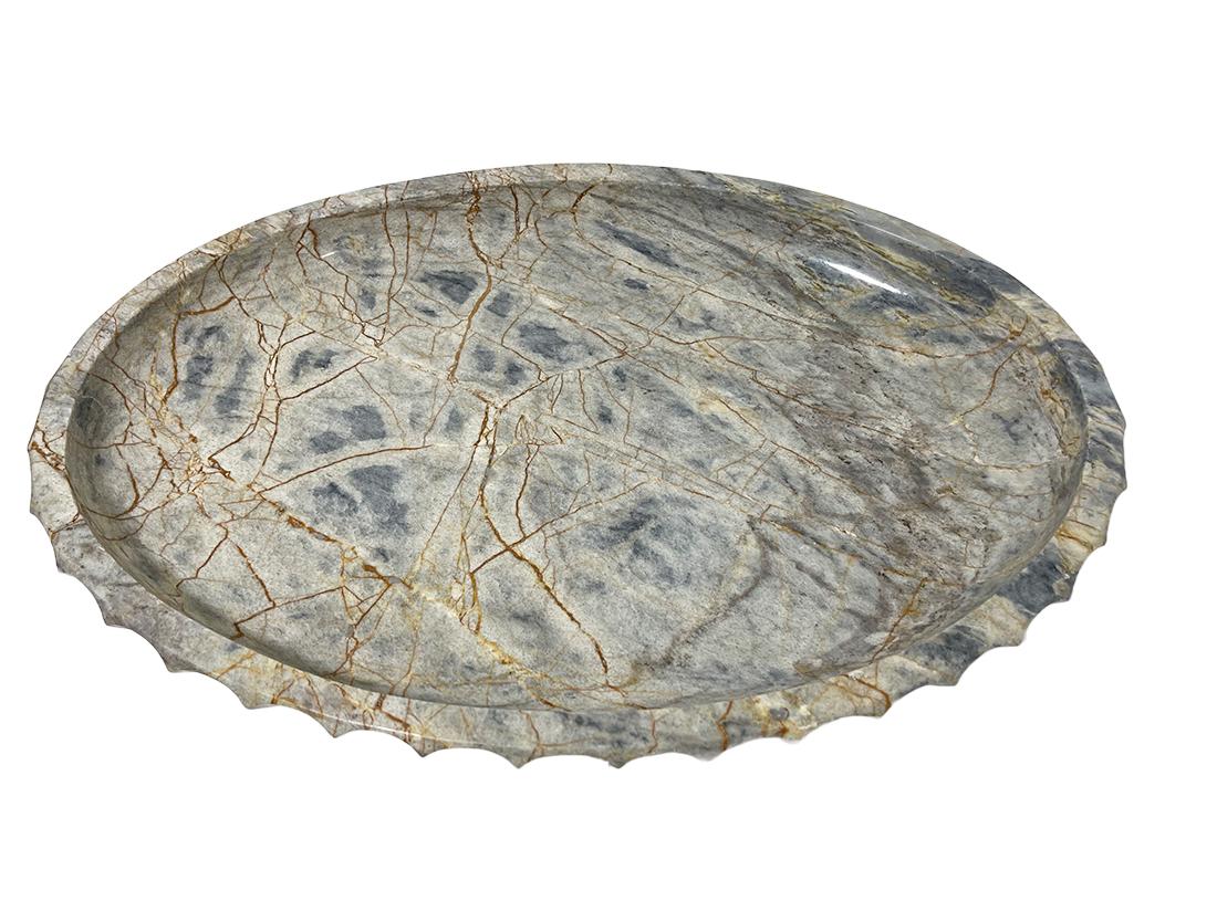 19th Century marble oval Tazza centerpiece bowl

A beautifully marbled bowl on foot with a scalloped outer rim. The lines of the marble from beige to dark brown and marbled light gray to dark gray. 
The bowl is 19 cm high, 53 cm wide and 37 cm