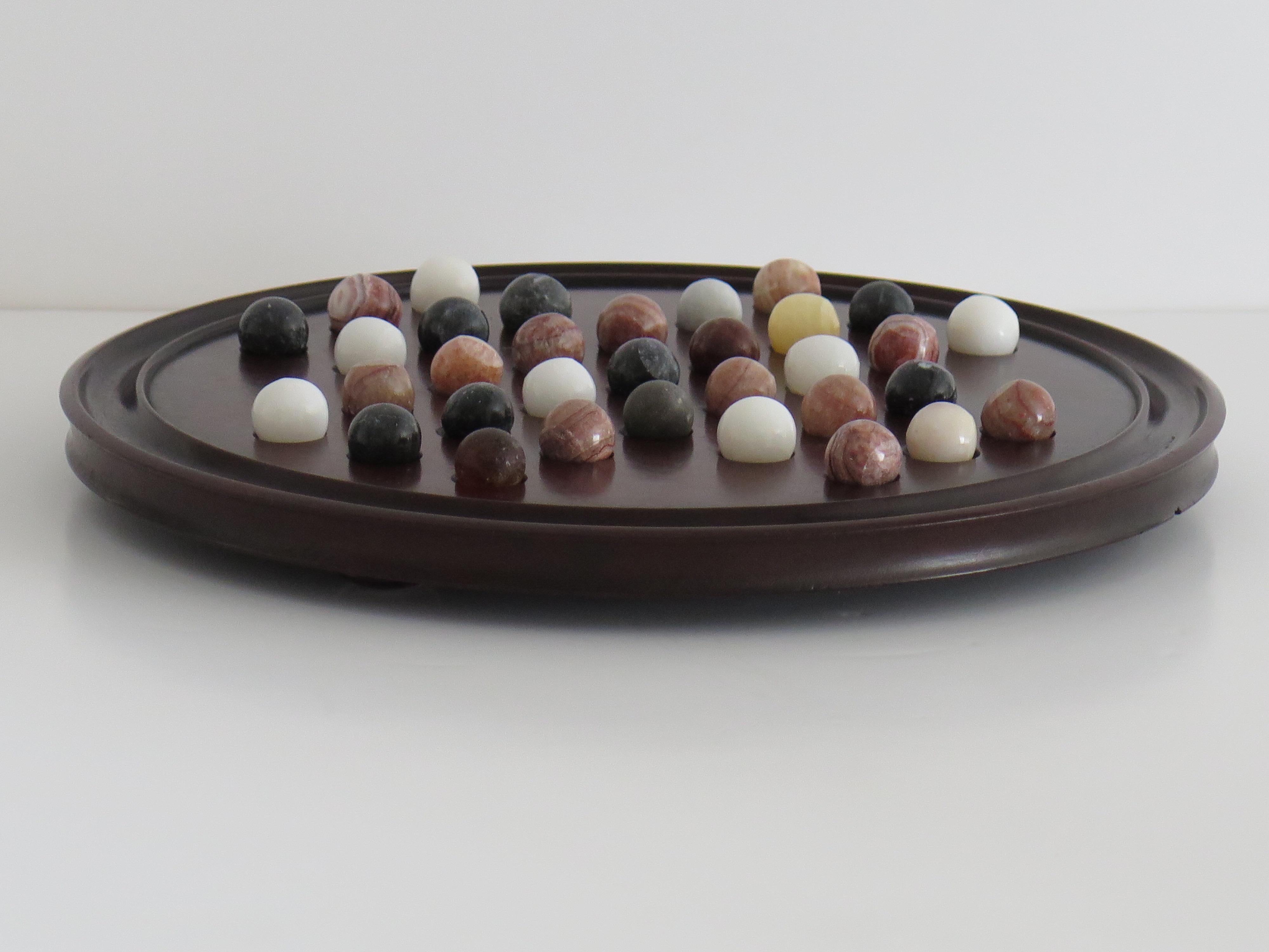 19th Century 19th C. Marble Solitaire Game large diameter Hardwood Board and 33 agate marbles