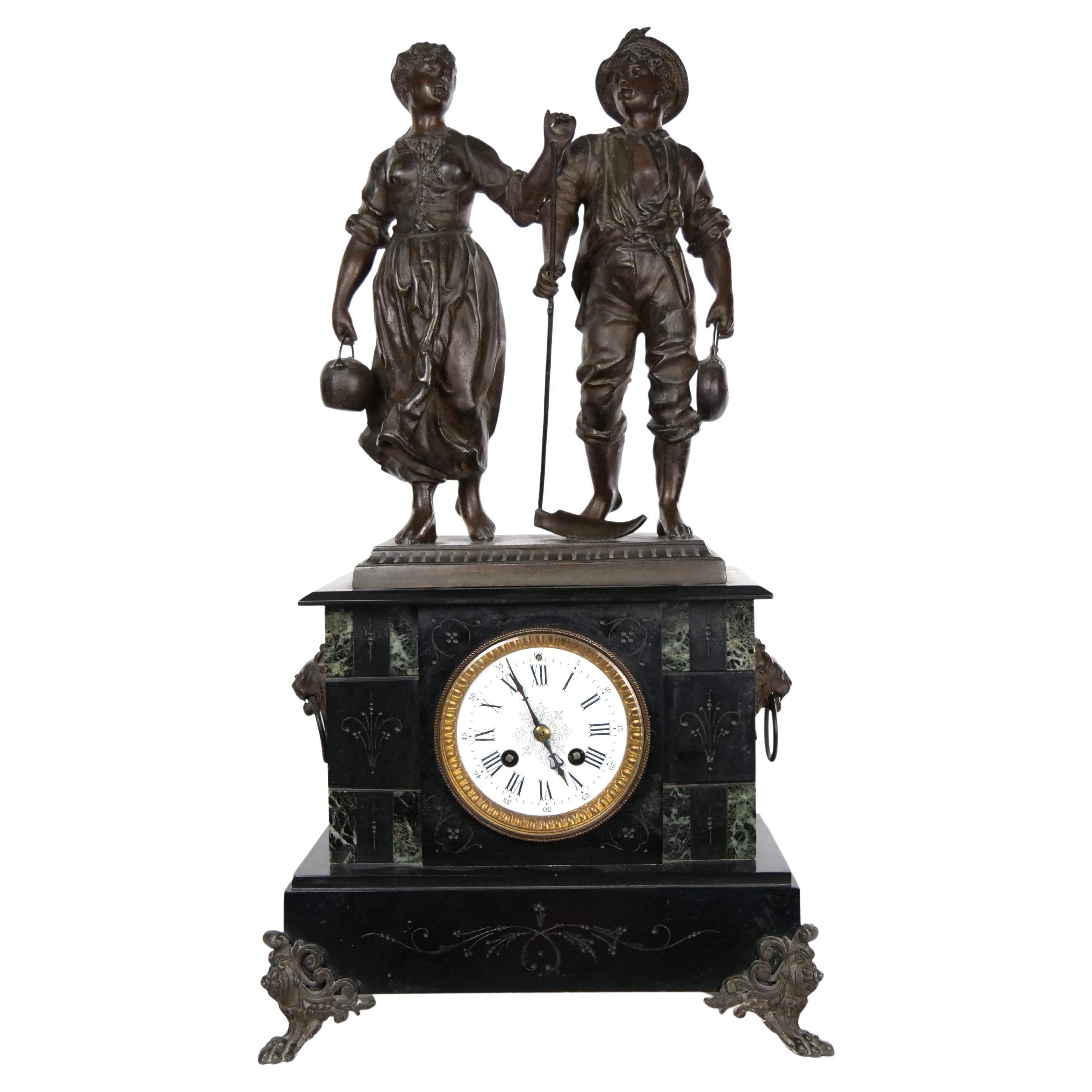 Mid 19th century marble and bronze Spelter three piece clock garniture set. Each piece is in good condition with appropriate wear consistent with age / use. The clock measure 23 inches high x 11 inches wide x 7 inches deep. Each side piece stands 17