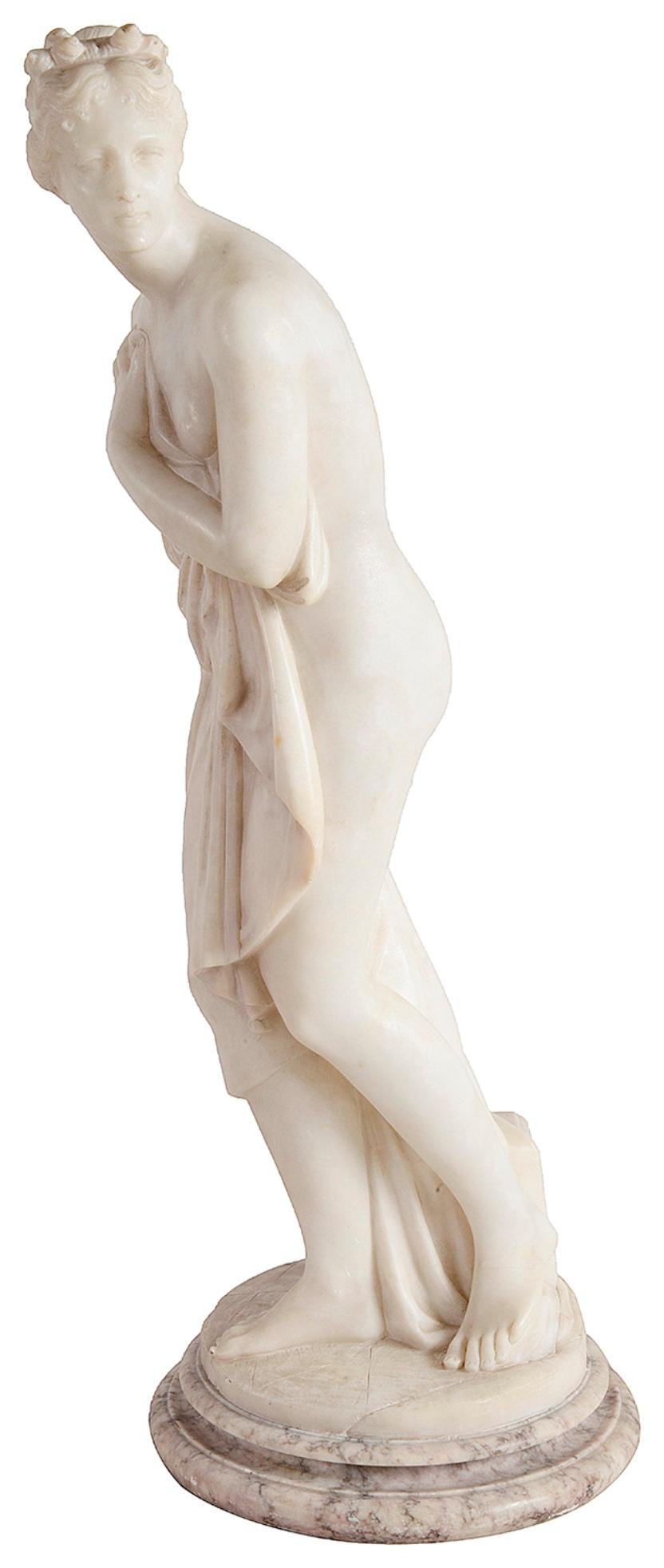 A beautiful 19th Century carved Carrera marble statue of Venus Au Bain, Italian, circa 1880.