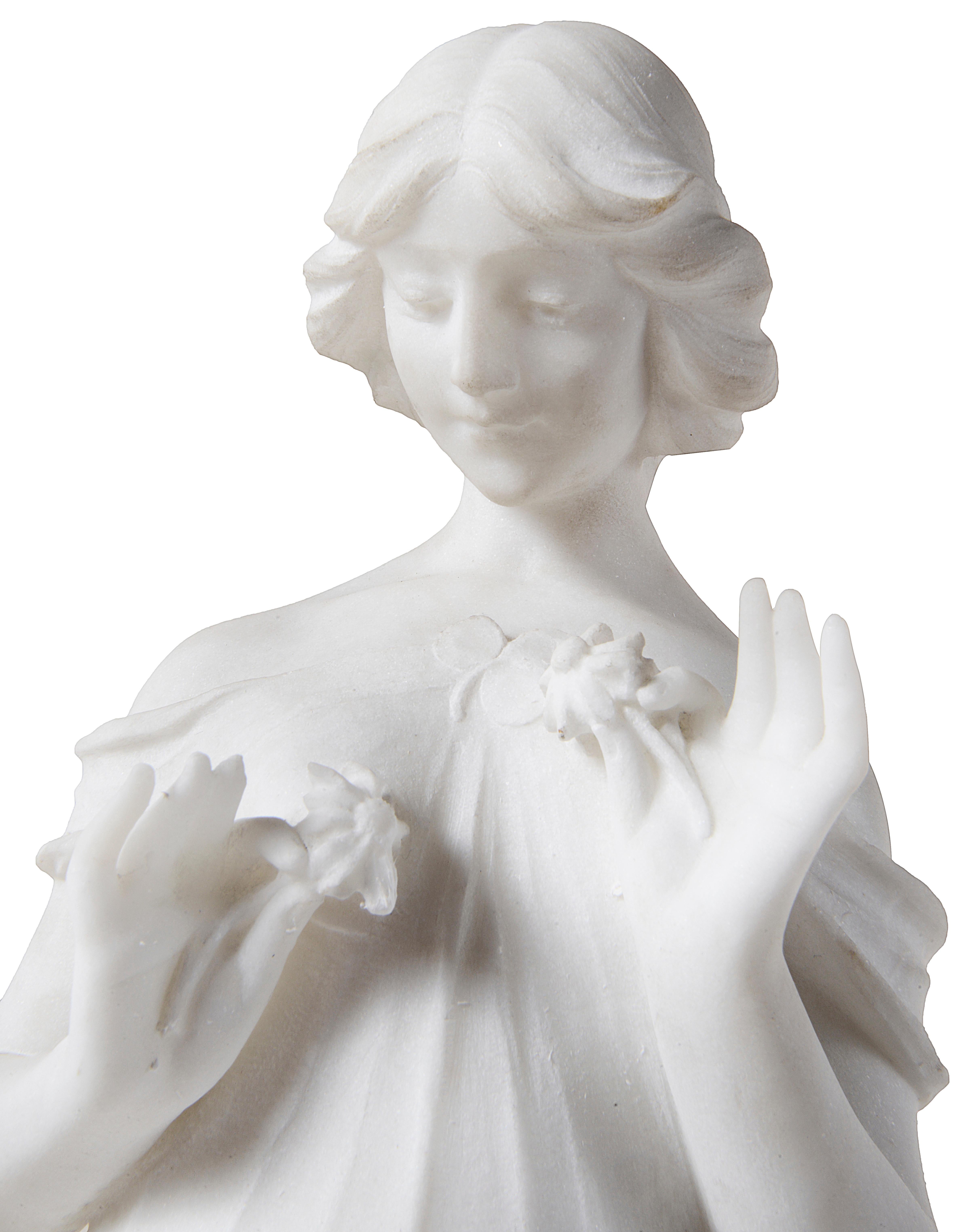 A good quality late 19th century Italian Carrara marble statue of a young girl walking, hold flowers.
  