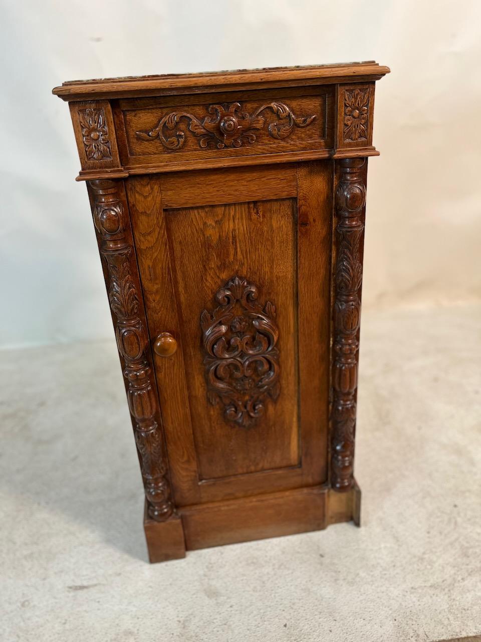 19th century Renaissance Revival marble top carved nightstand/cabinet.
One drawer with lower cabinet.  Intricately carved.  Mahogany, pine, marble.  Mid-Victorian period.
