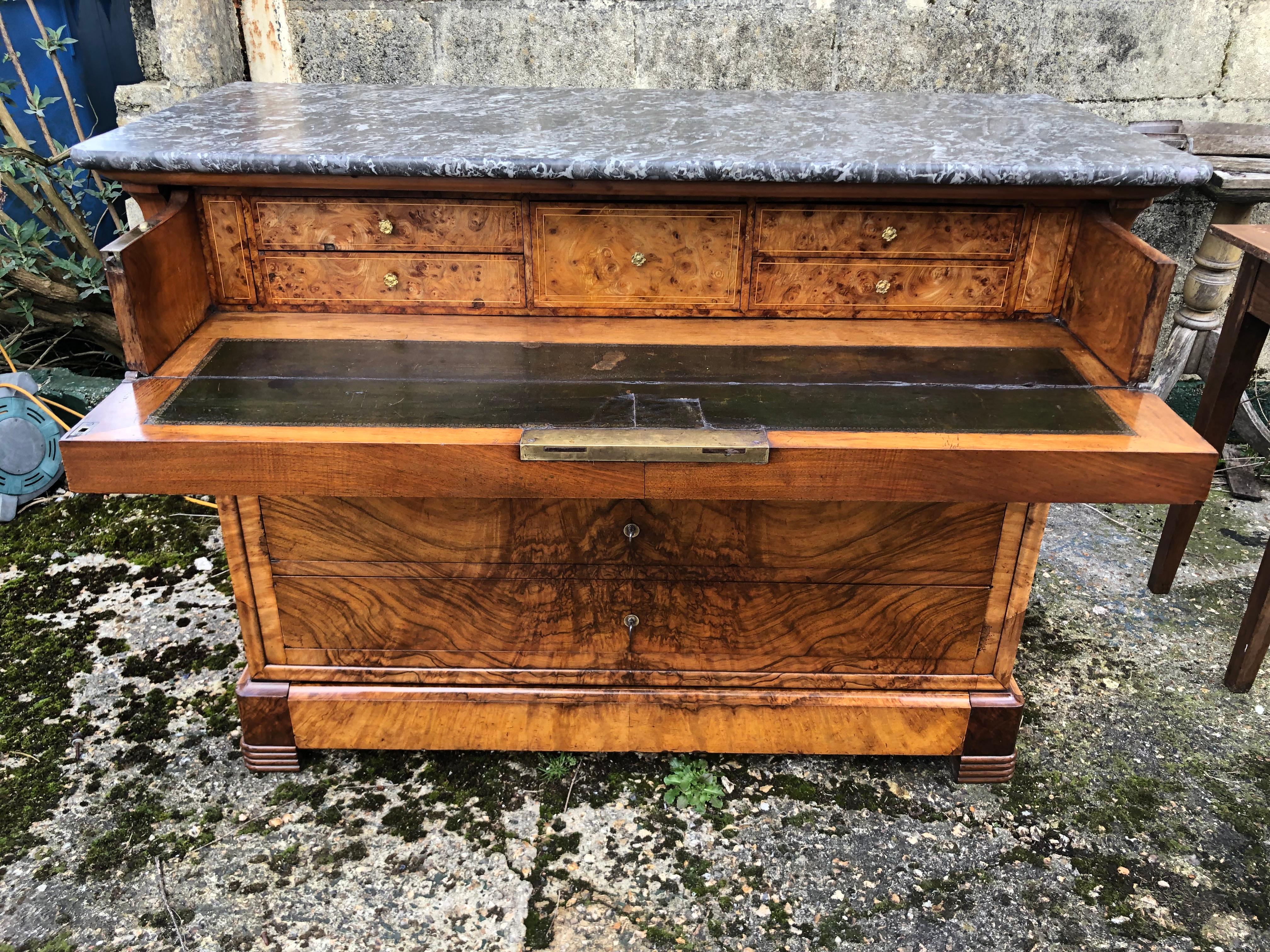 A truly stunning superior quality French burr walnut and marble topped Louis Philippe commode chest of drawers. The secretaire drawer at the top opening to reveal the original leather writing surface.