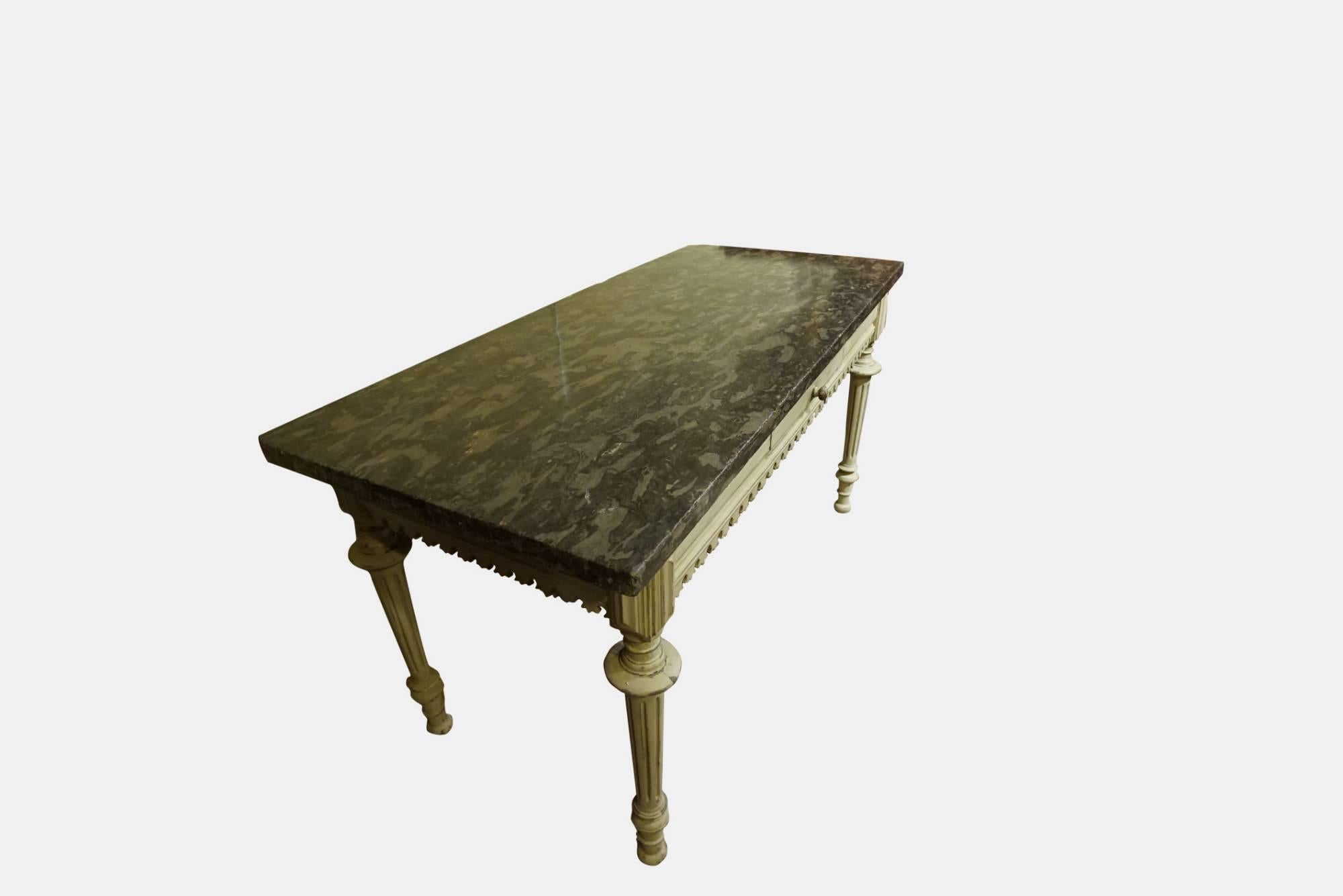 A 19thcentury green/grey marble-top serving table with painted base and single drawer on turned legs. The marble probably earlier. Measures: 4cm thick.