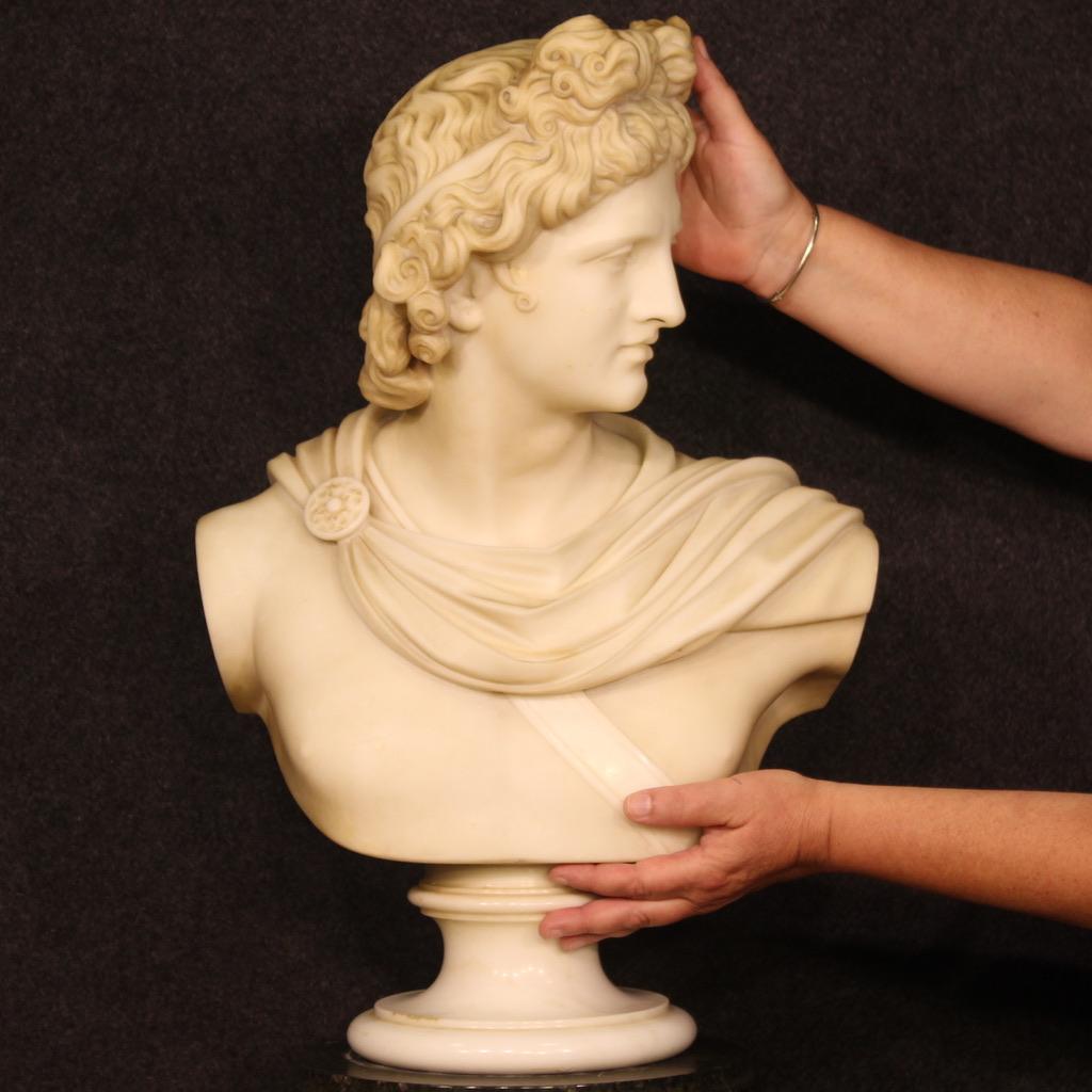 Elegant Italian sculpture from the late 19th century. Statue in white statuary marble of excellent size, quality and proportion depicting the half-bust of the god Apollo. Statue in neoclassical style inspired by the famous 