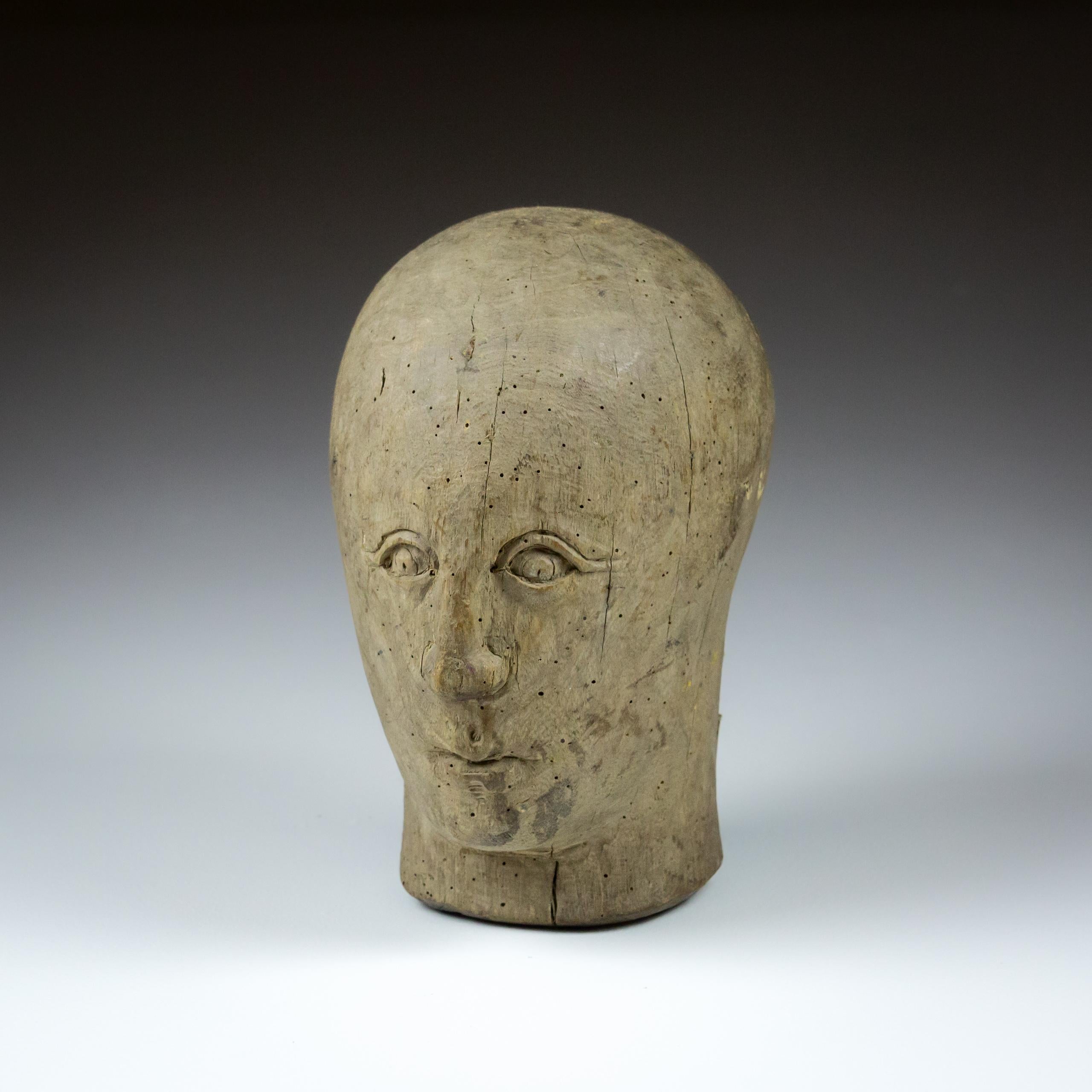 19th Century Carved wood marotte or milliners head. Solid wood, with carved engaging primitive features. France Circa 1860. Drying split to reverse