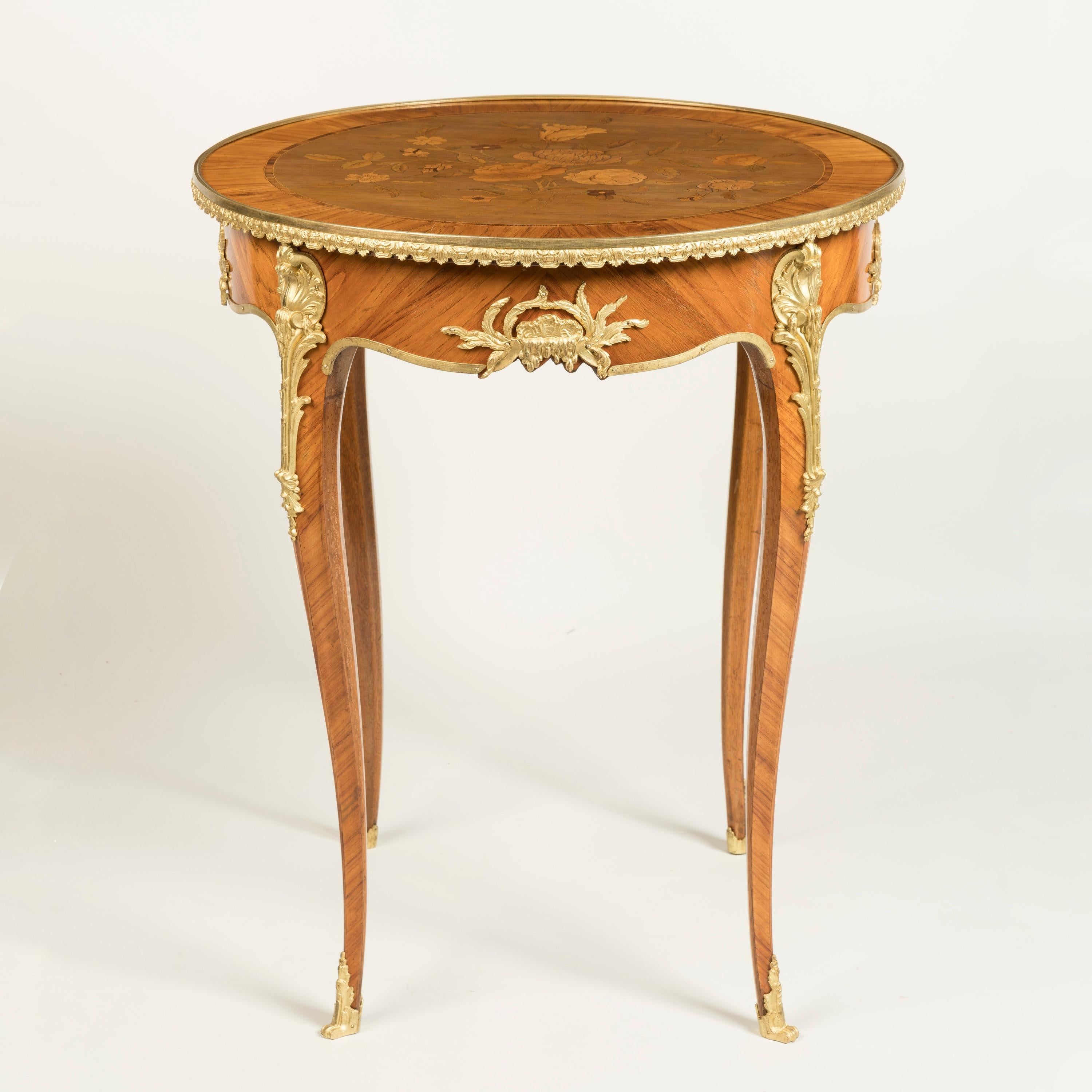 A Very Fine Marquetry Inlaid Occasional Table
Firmly Attributed to François Linke

This fine table, closely related to other examples by François Linke, is veneered with tulipwood and dressed with fine ormolu mounts; the circular table supported on