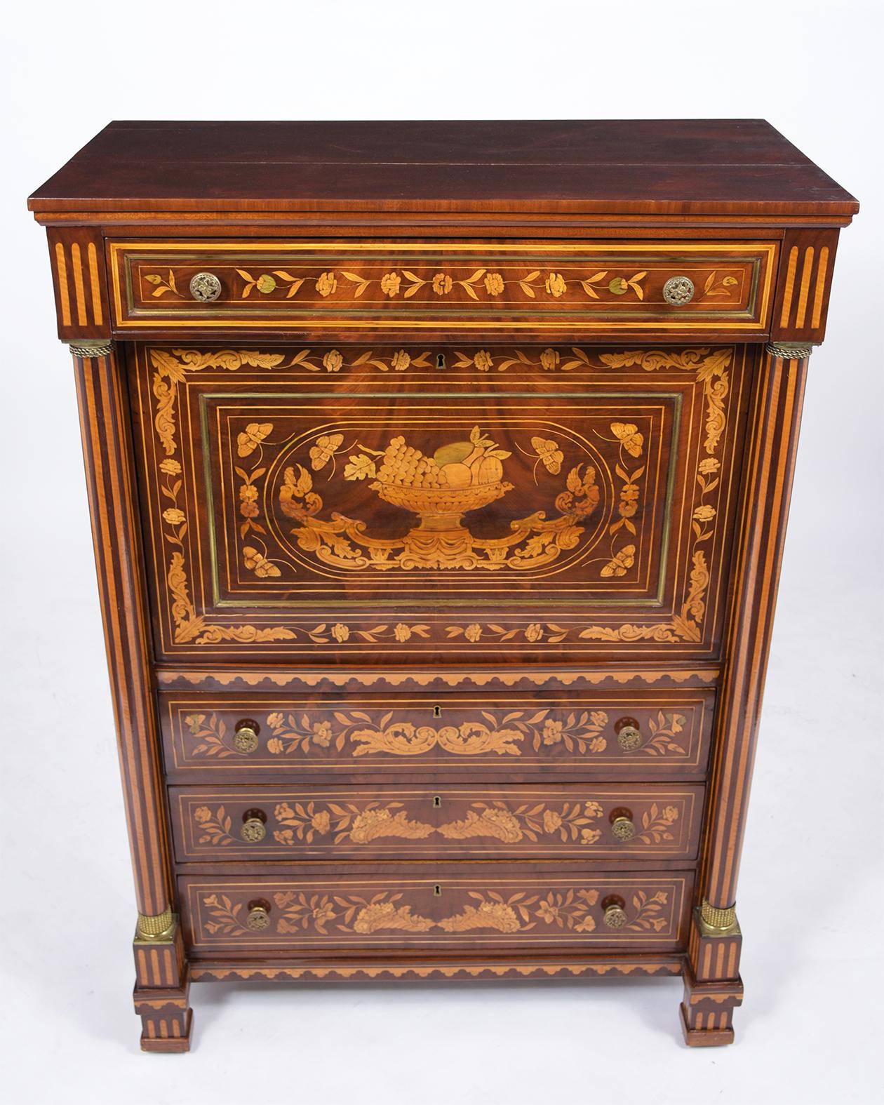 This 19th-century marquetry secretaire is handcrafted out of maple wood good condition, is covered in an elegant marquetry design throughout the piece, and has been newly restored by our team of expert craftsmen. The drop-top desk features four