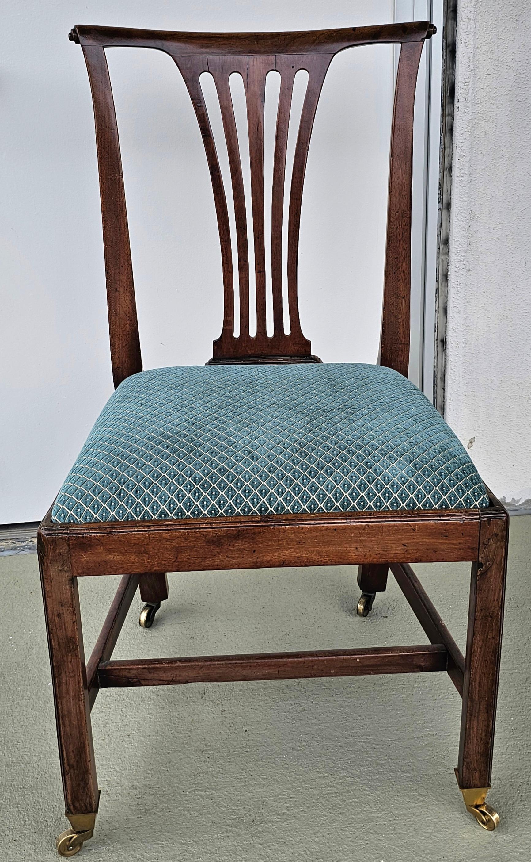 A 19th Century Martin Chippendale Style Mahogany and Upholstered Side Chair on Casters.
Measures 20