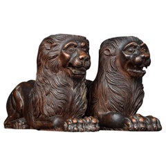 Used 19th Century Matched Pair of Recumbent Carved Mahogany Lions