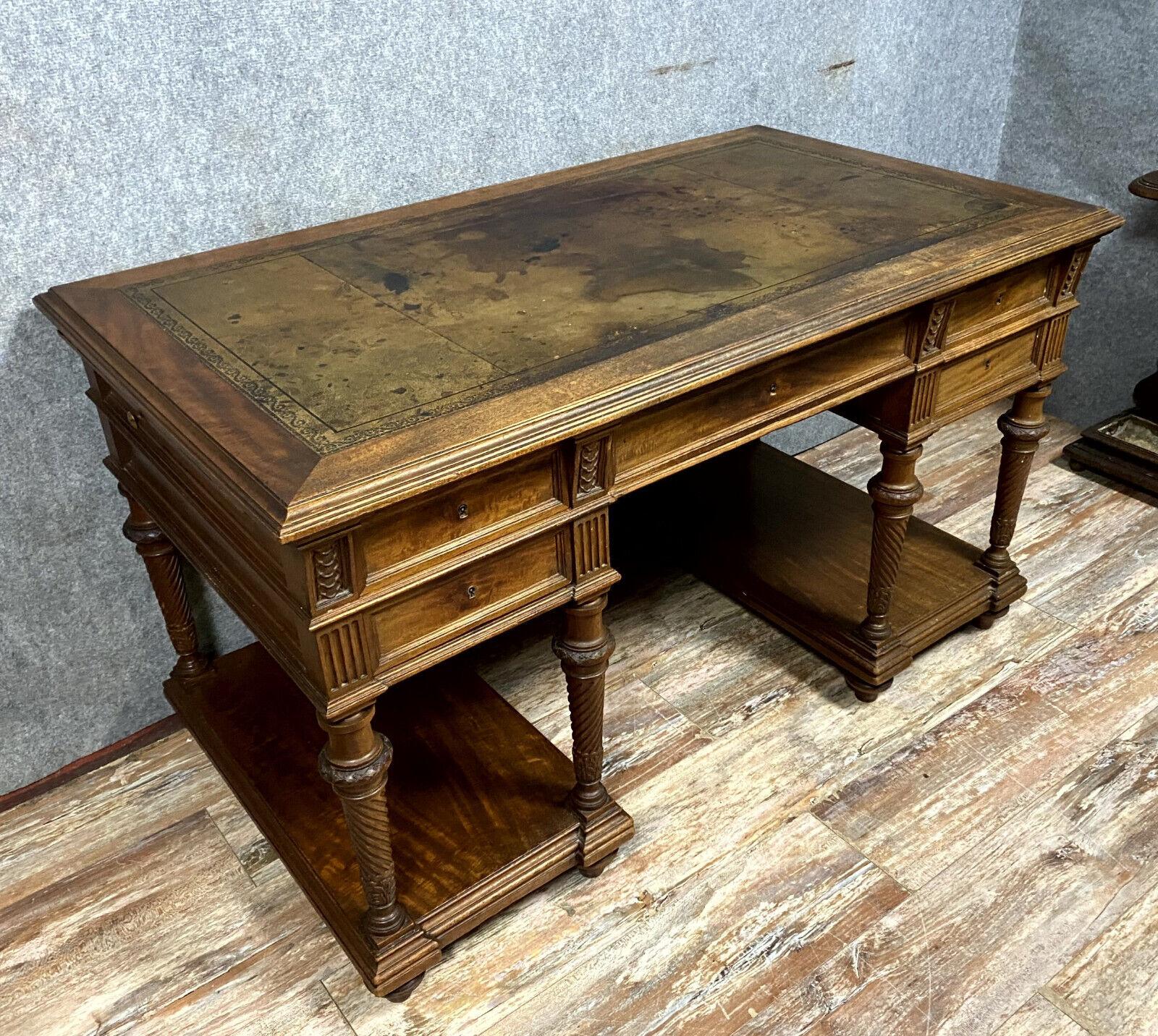 Add a touch of timeless elegance to your study or office with this exquisite Mazarin style center desk from the 19th century. Crafted from rich walnut wood, this desk features a classic design and functional details that make it both a practical