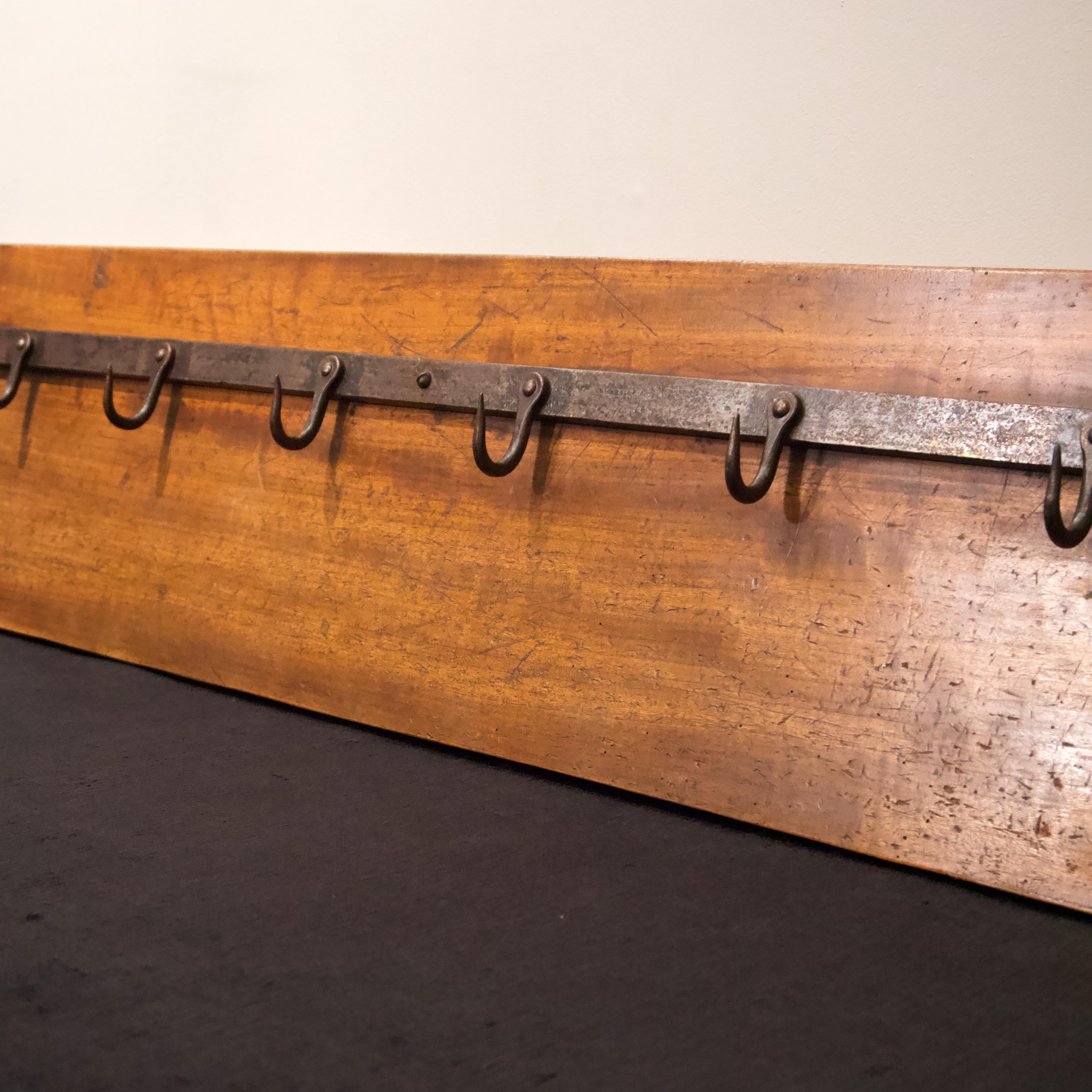 Steel meat hooks, mounted on solid walnut board with mounting (hanging) hardware.