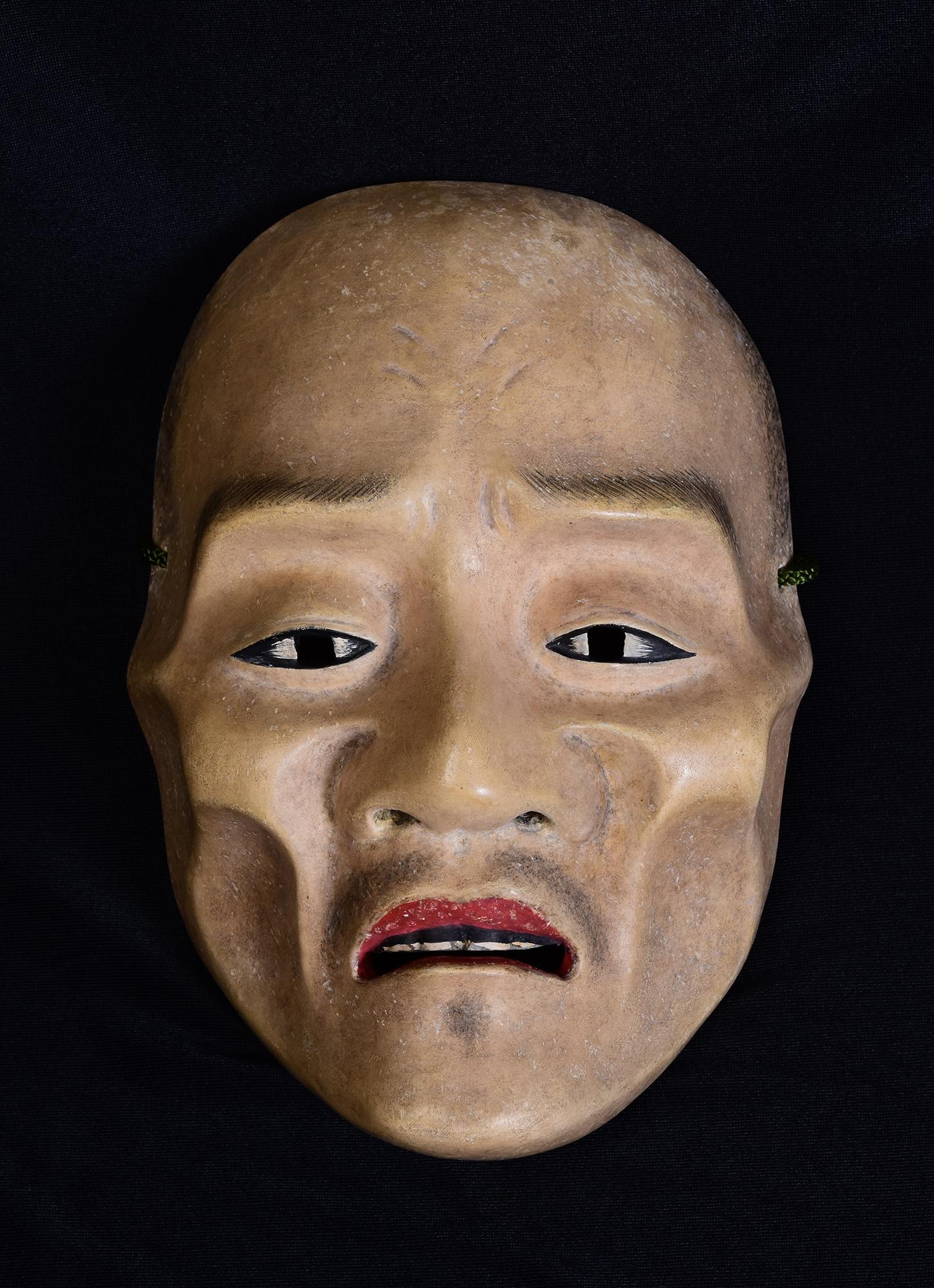 Antique Japanese wooden Noh mask.

Age: Japan, Meiji Period, 19th Century
Size: Length 21.7 C.M. / Width 15 C.M. / Thickness 8.5 C.M.
Condition: Nice condition overall (some expected degradation due to its age).

100% satisfaction and authenticity
